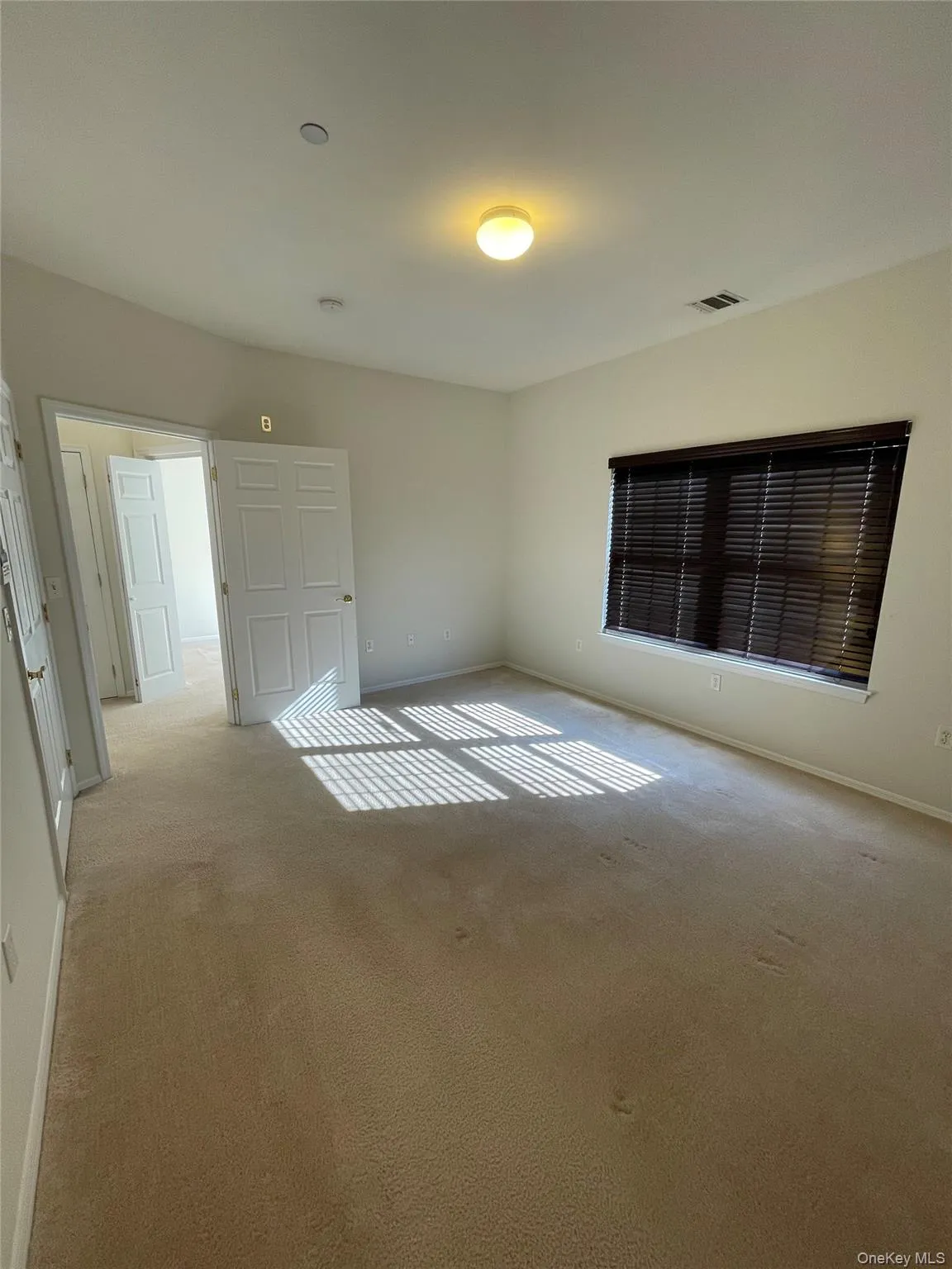 Unfurnished bedroom with carpet and baseboards Unfurnished bedroom with carpet and baseboards