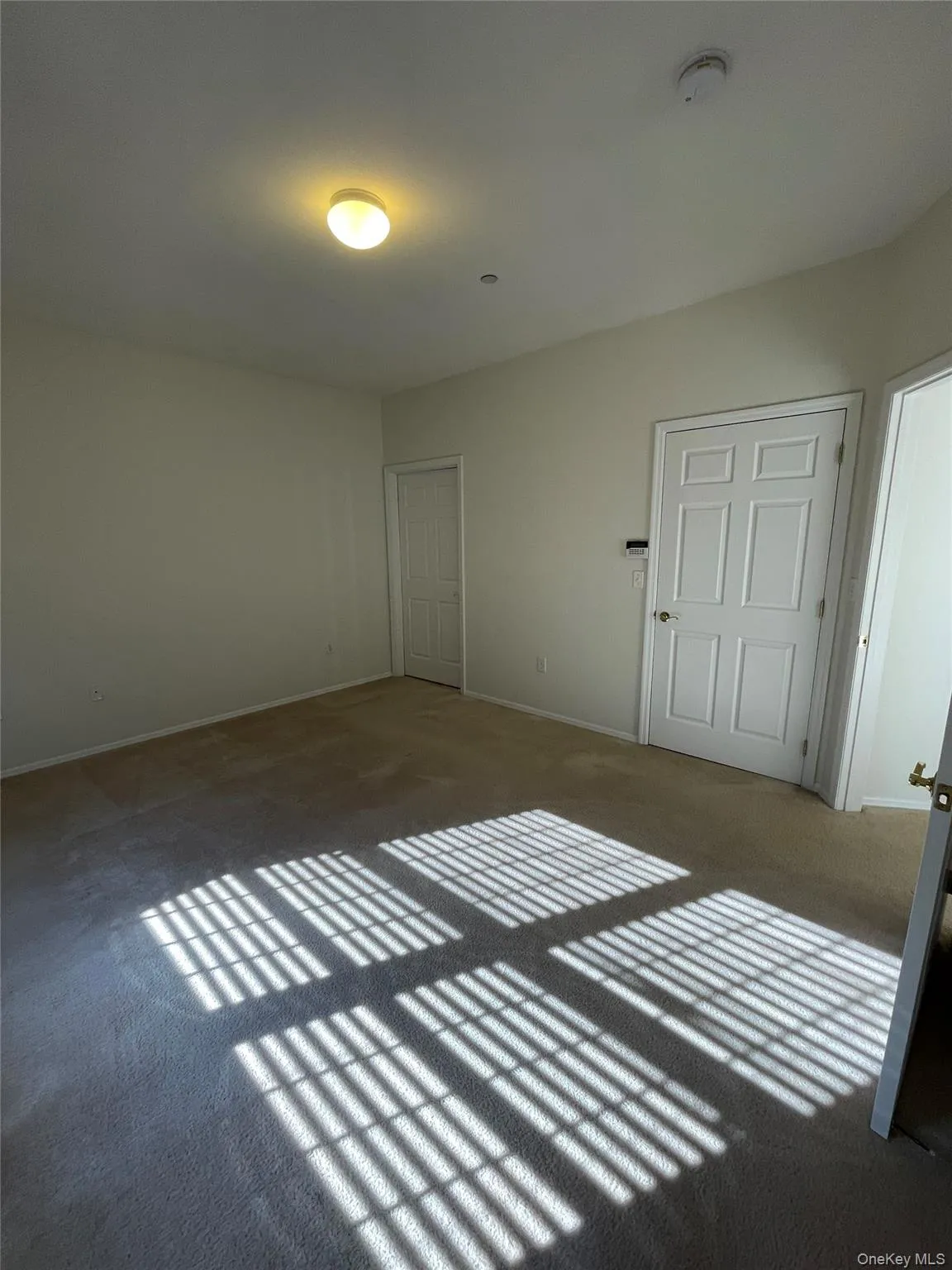 Unfurnished bedroom with carpet Unfurnished bedroom with carpet