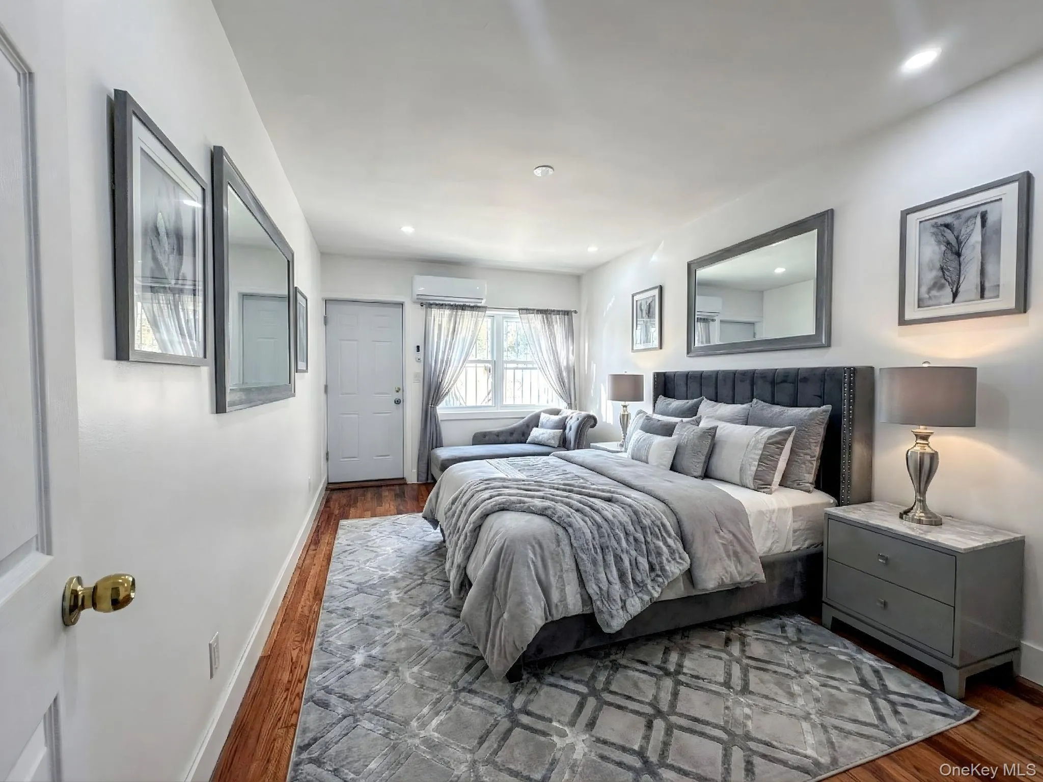 Bedroom with wood finished floors and recessed lighting Bedroom with wood finished floors and recessed lighting