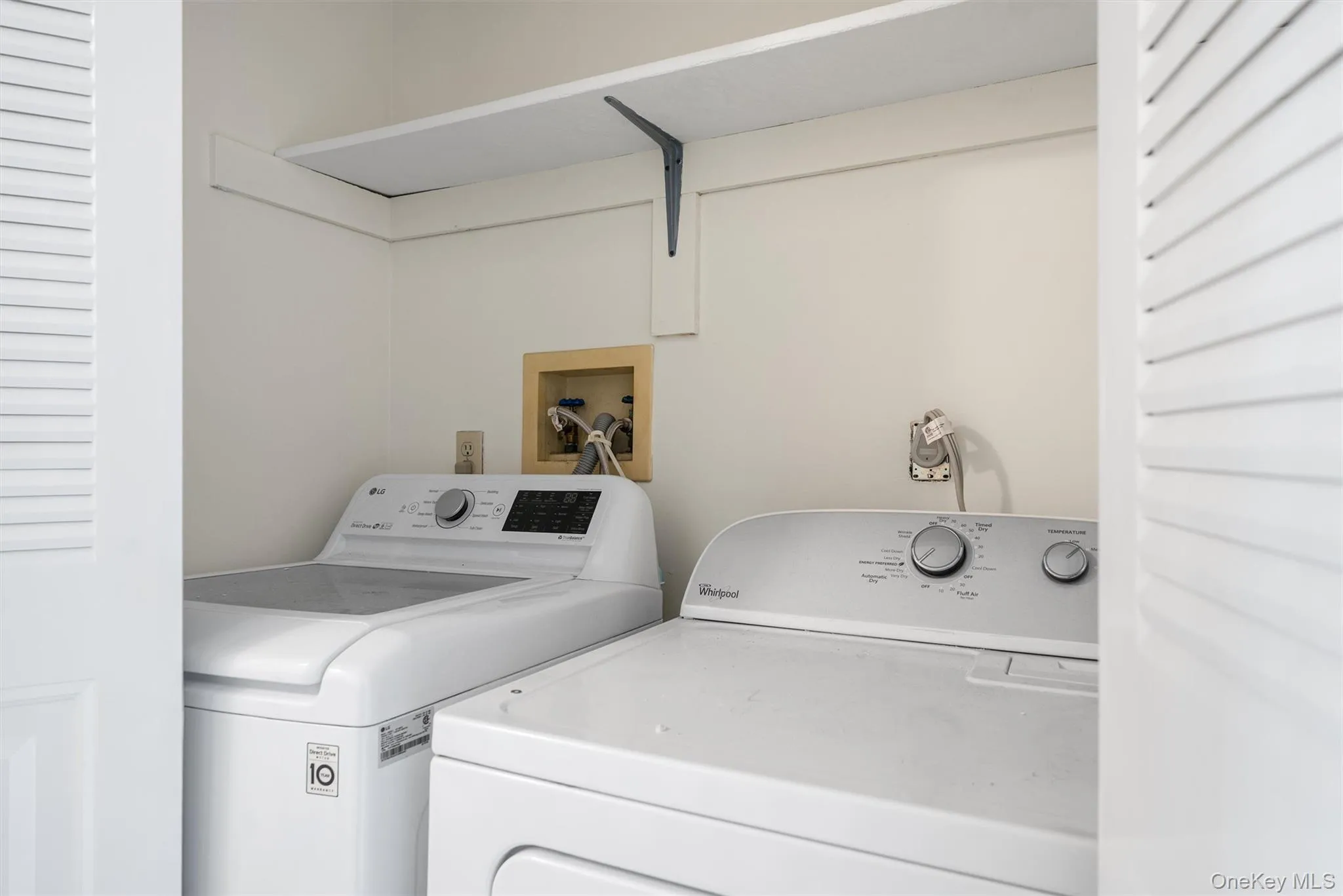 Laundry area featuring washing machine and clothes dryer Laundry area featuring washing machine and clothes dryer