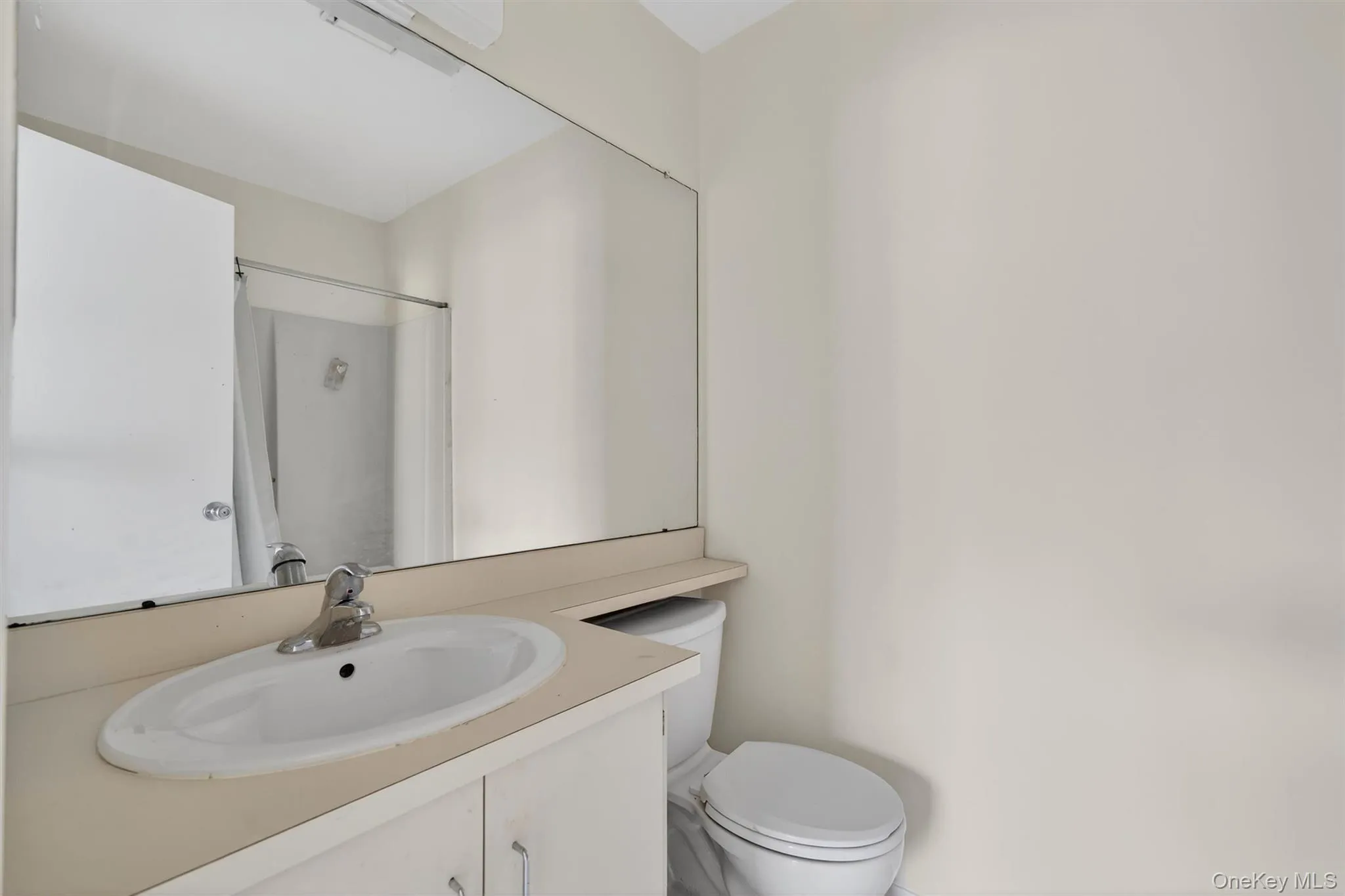 Bathroom with a shower and vanity Bathroom with a shower and vanity