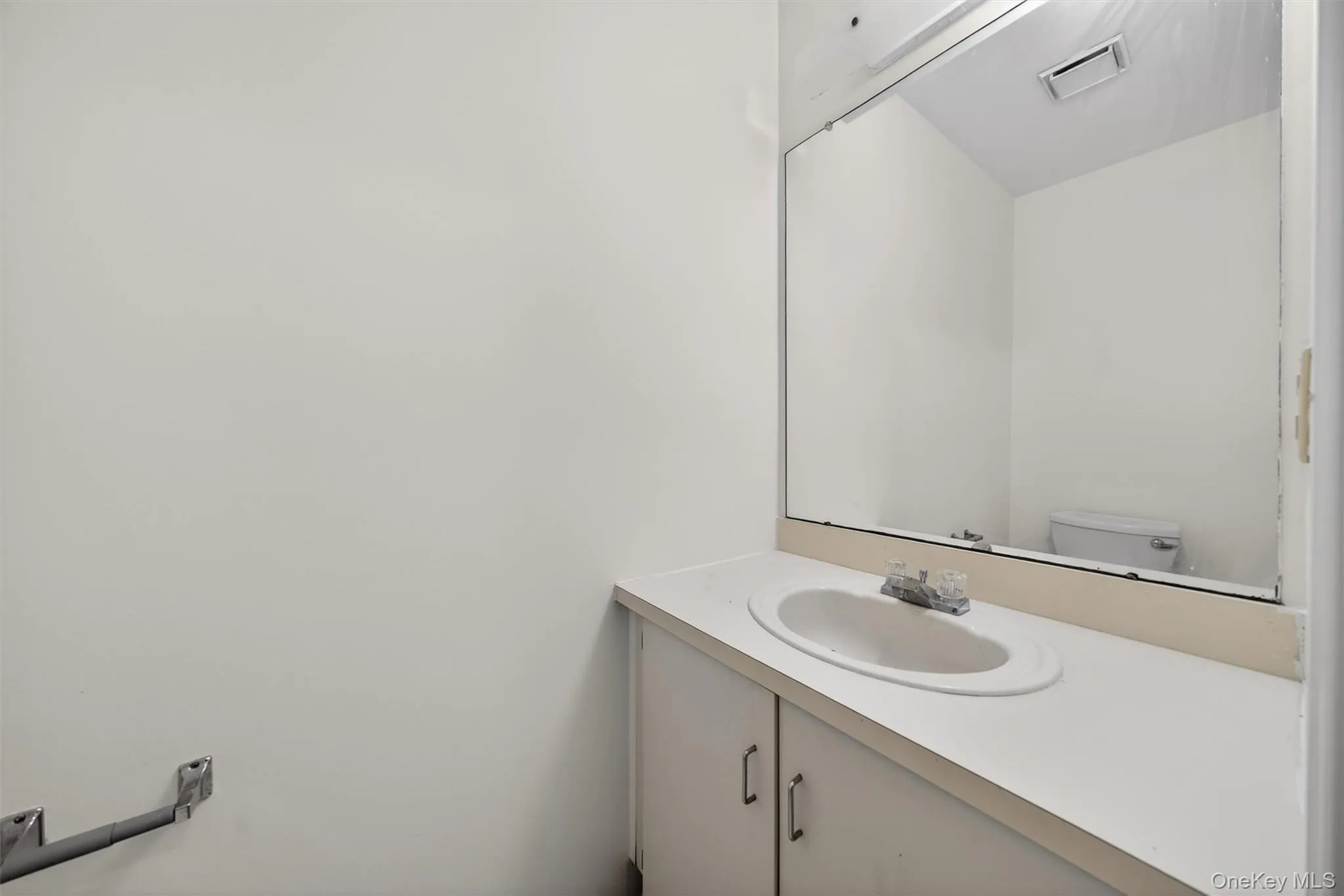 Half bath with vanity and toilet Half bath with vanity and toilet