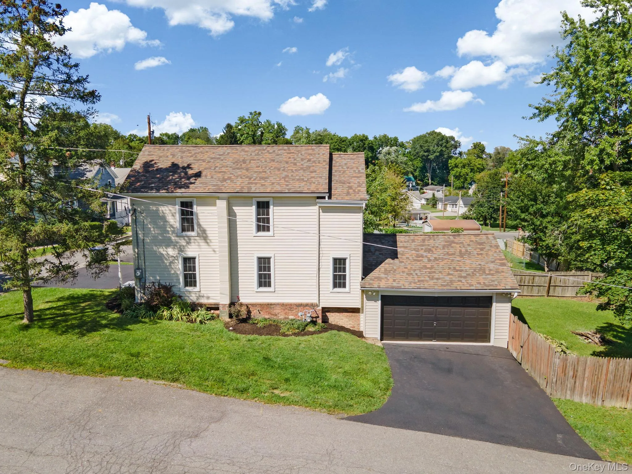 Colonial inspired home with a shingled roof Colonial inspired home with a shingled roof
