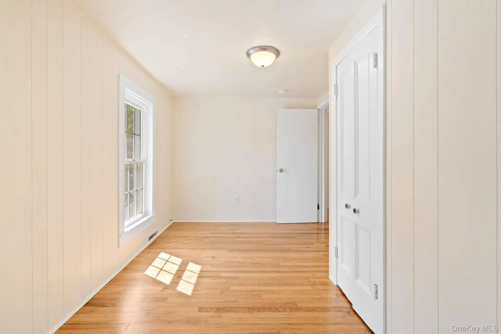 Hall with light wood-style flooring Hall with light wood-style flooring