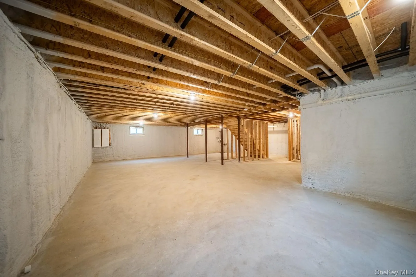 Basement featuring stairs Basement featuring stairs