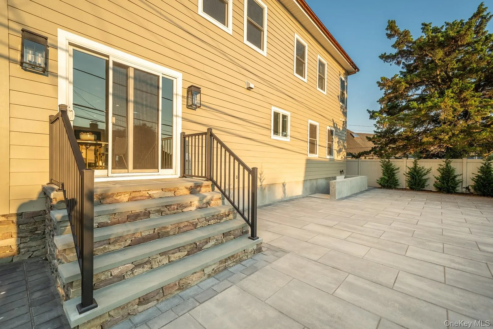 View of exterior entry with a patio area View of exterior entry with a patio area