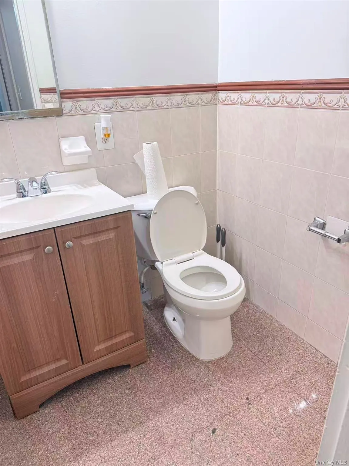 Bathroom featuring tile walls and vanity Bathroom featuring tile walls and vanity