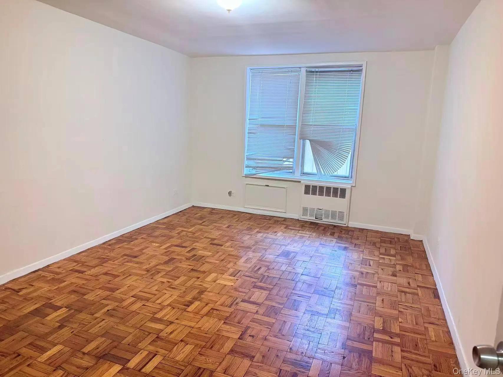 Empty room with baseboards and radiator Empty room with baseboards and radiator