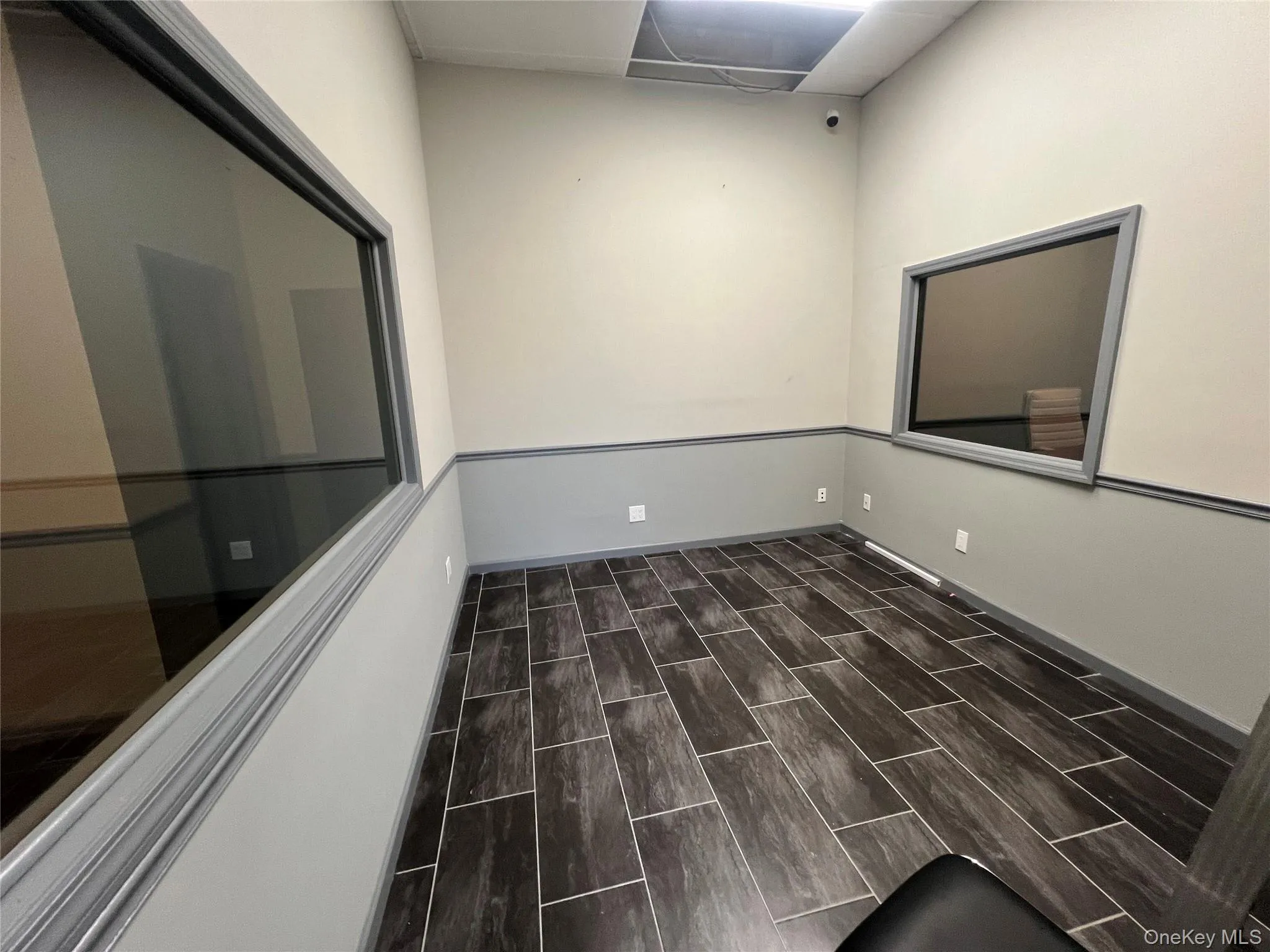 Spare room with wood tiled floors Spare room with wood tiled floors