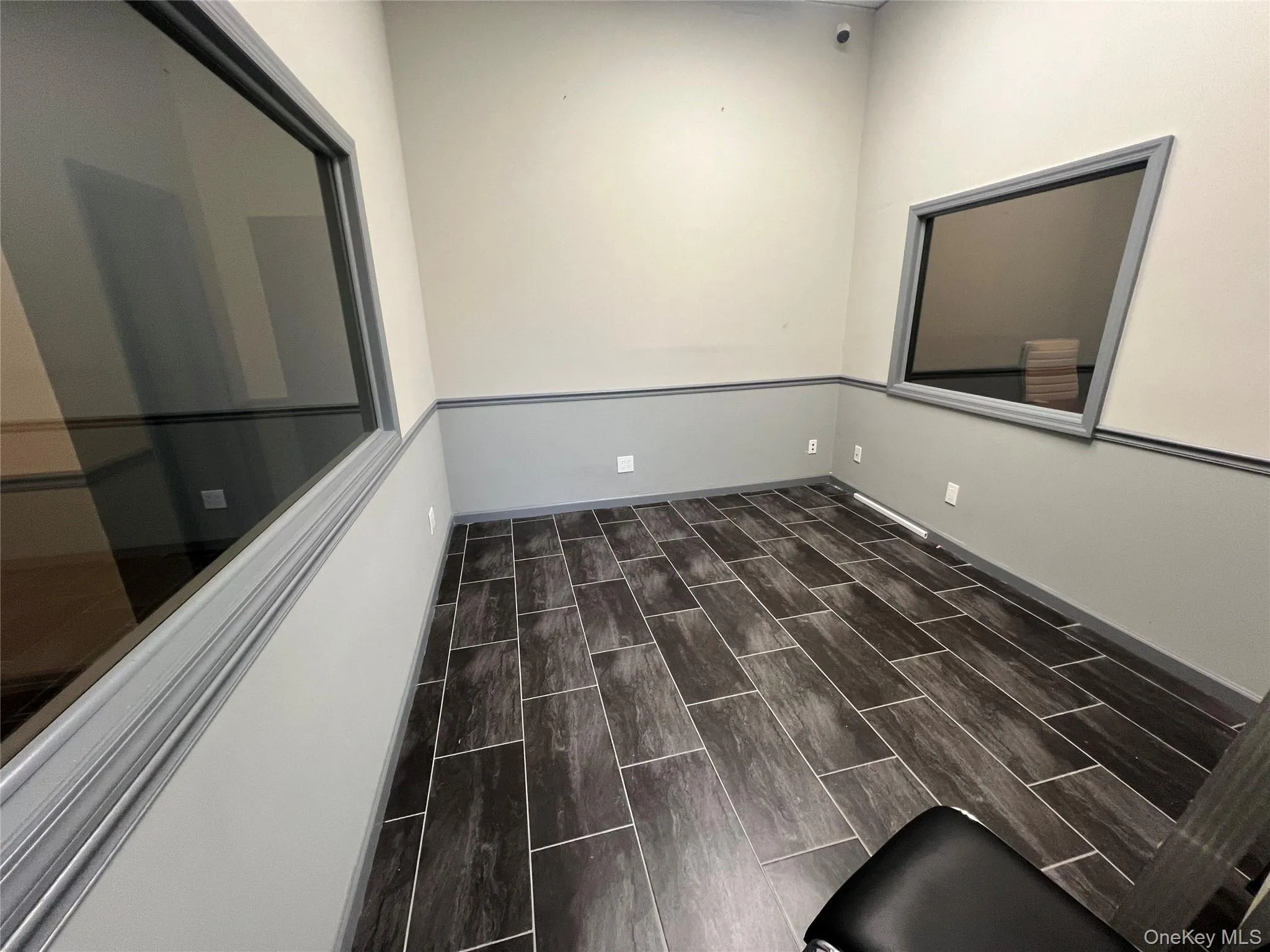 Spare room featuring wood finish floors Spare room featuring wood finish floors