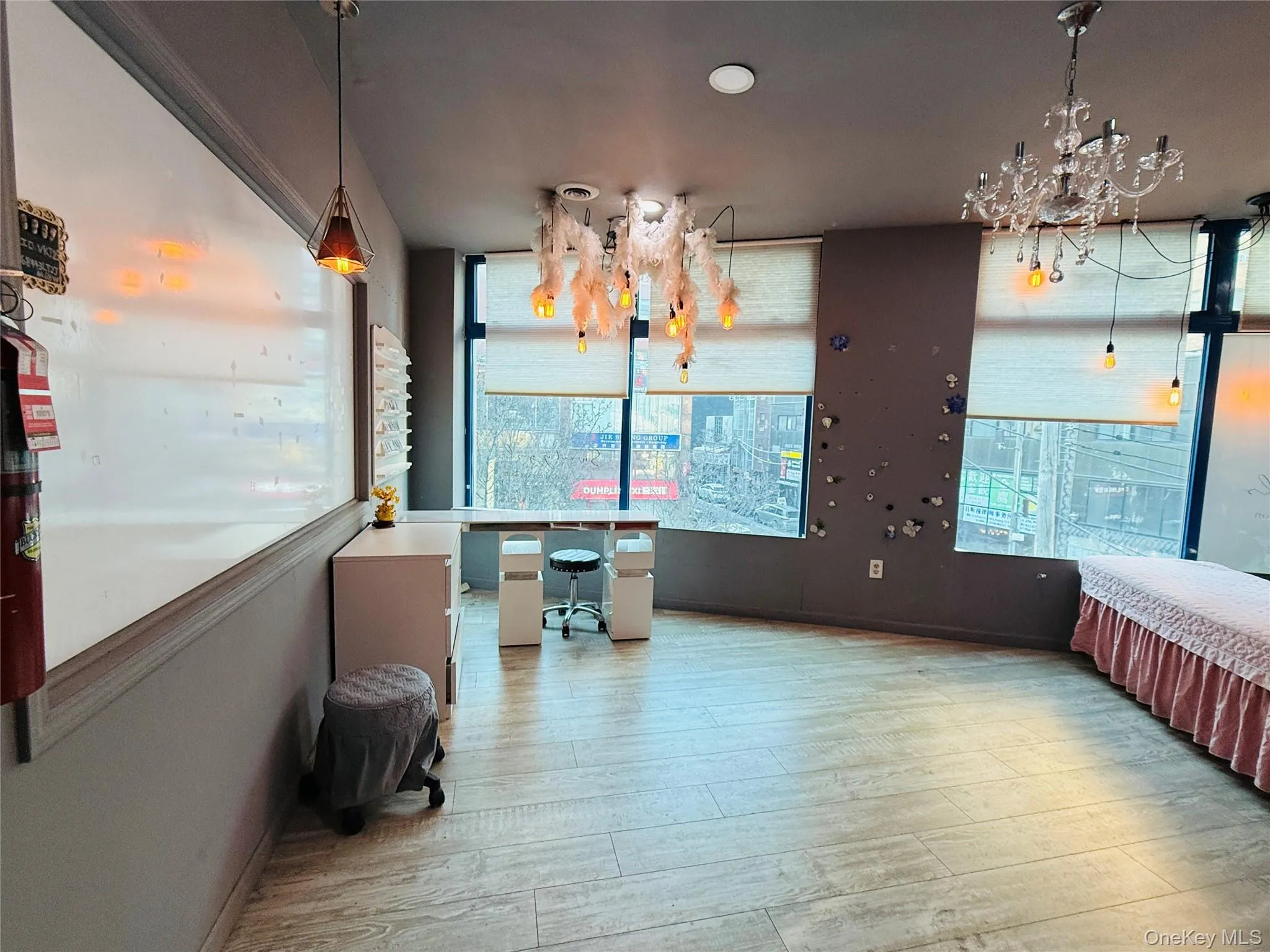 Unfurnished dining area with light wood-style floors, plenty of natural light, and a chandelier Unfurnished dining area with light wood-style floors, plenty of natural light, and a chandelier