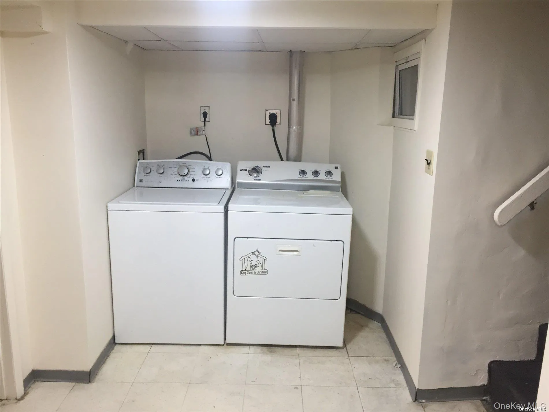 Washroom with baseboards and separate washer and dryer Washroom with baseboards and separate washer and dryer
