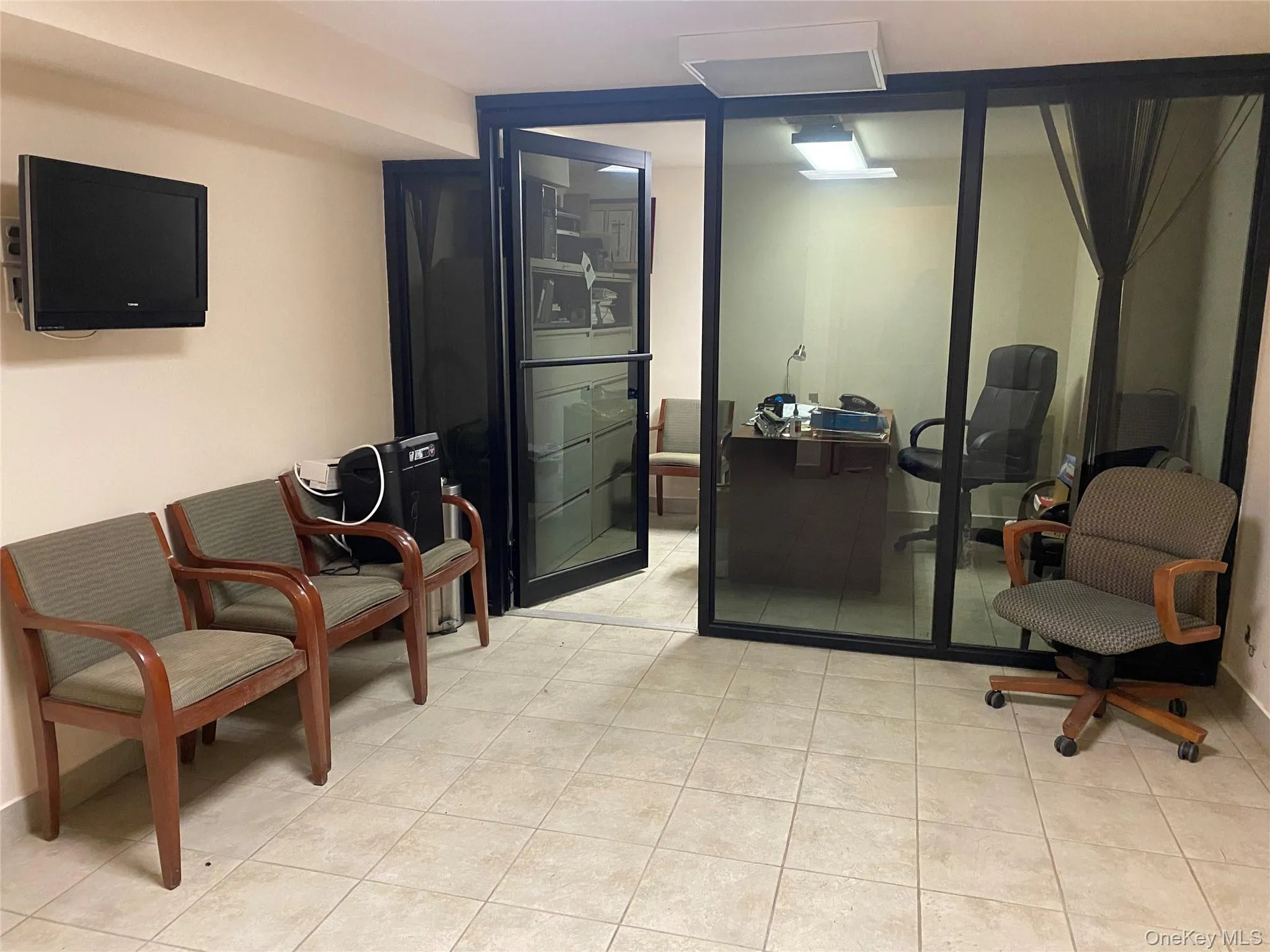 Living area with light tile patterned floors Living area with light tile patterned floors