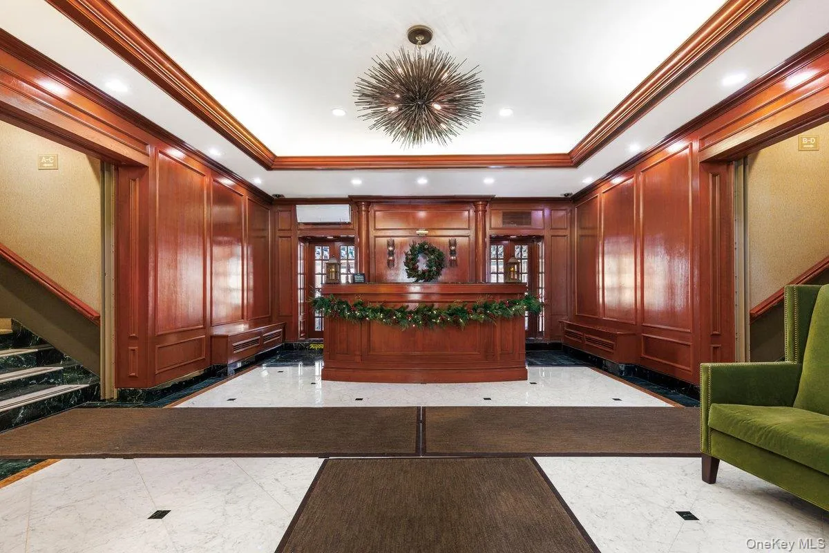 Welcome area featuring stairway, a decorative wall, ornamental molding, and recessed lighting Welcome area featuring stairway, a decorative wall, ornamental molding, and recessed lighting