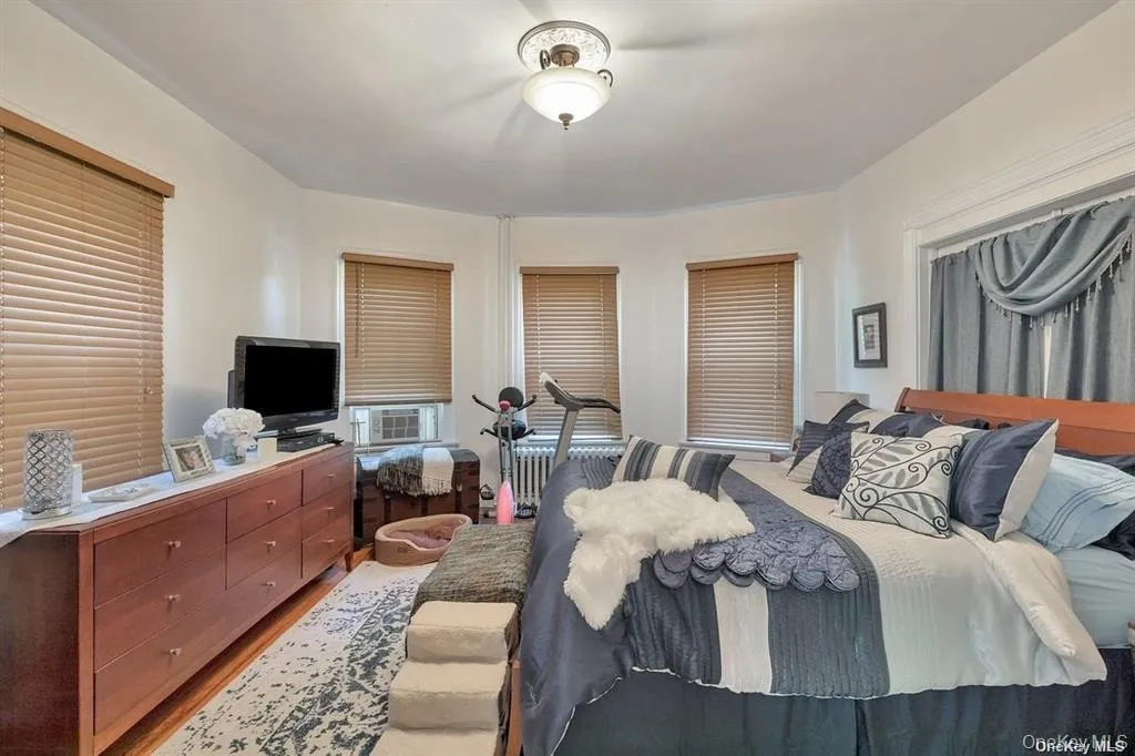 Bedroom featuring wood finished floors Bedroom featuring wood finished floors