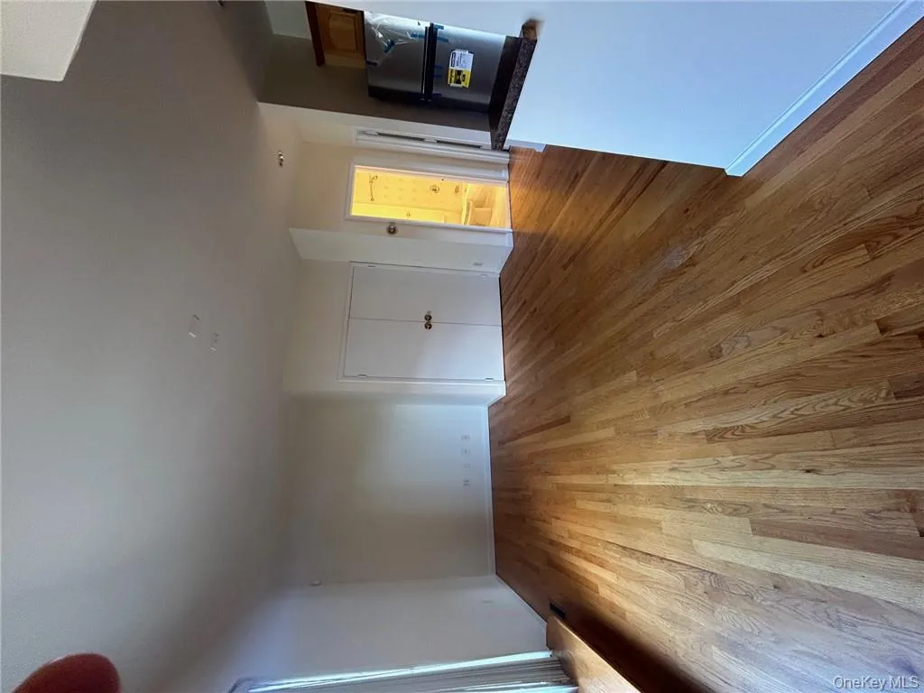 Unfurnished living room with light hardwood / wood-style flooring Unfurnished living room with light hardwood / wood-style flooring