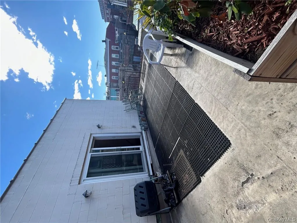 View of patio / terrace featuring a grill View of patio / terrace featuring a grill