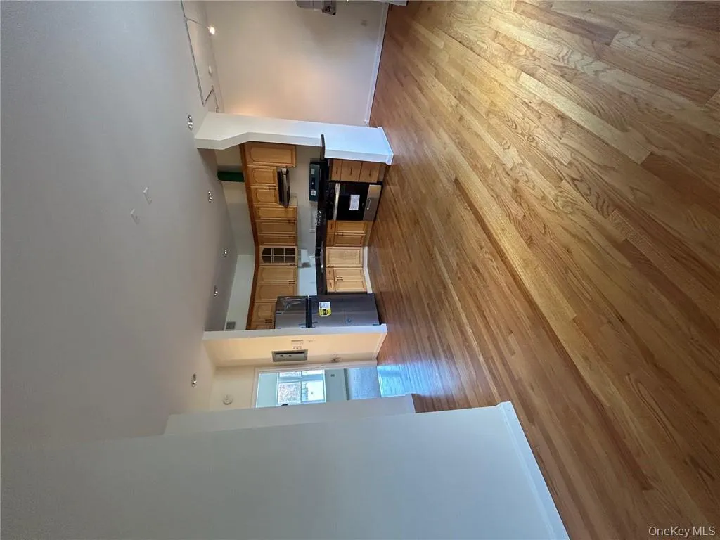 Open concept kitchen featuring fridge, light hardwood / wood-style flooring, ventilation hood, sink, and stove Open concept kitchen featuring fridge, light hardwood / wood-style flooring, ventilation hood, sink, and stove