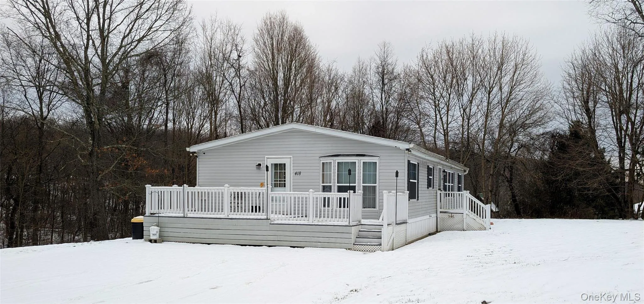 View of front of home featuring a deck View of front of home featuring a deck