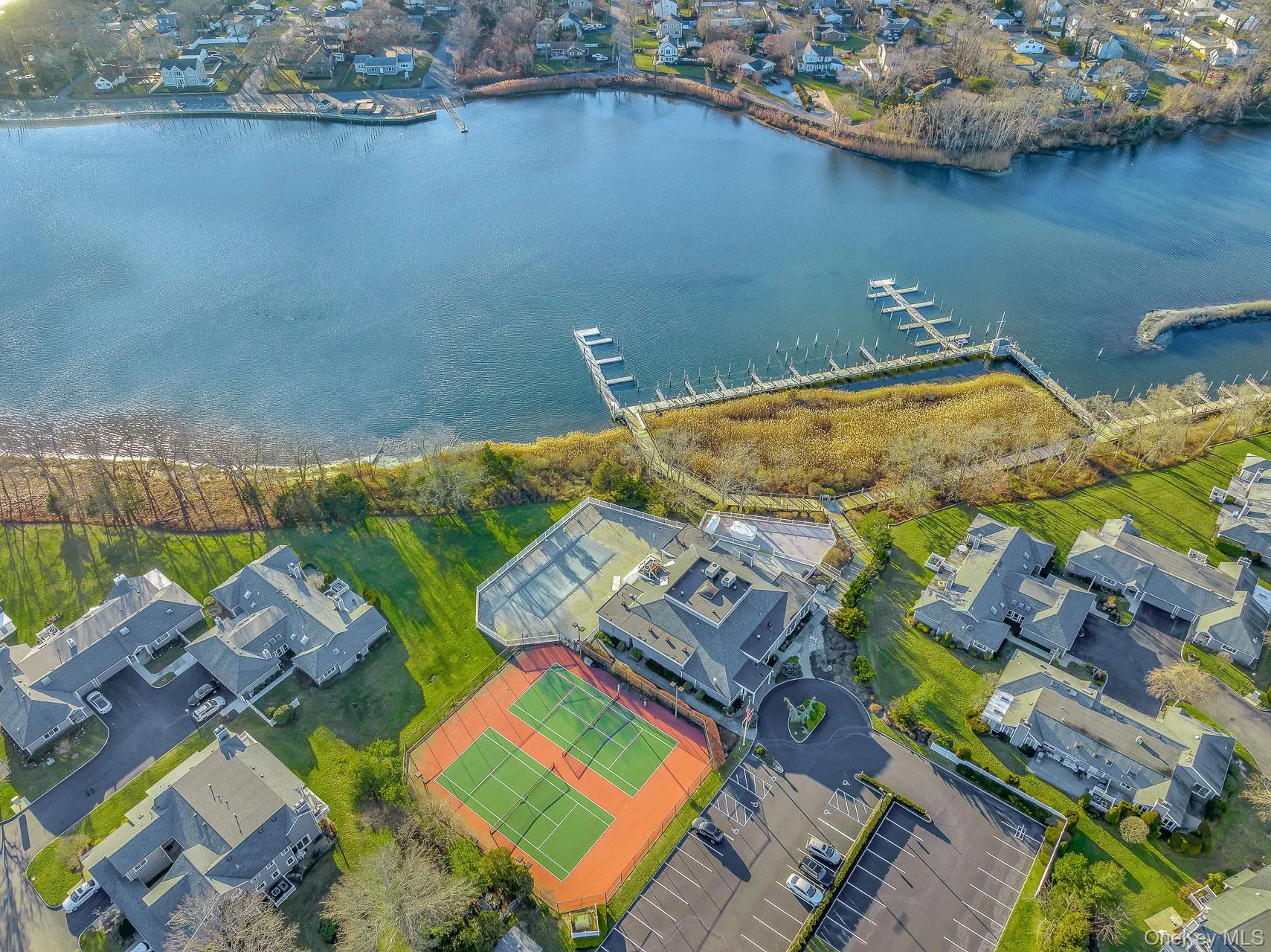 Aerial view of residential area with a large body of water Aerial view of residential area with a large body of water