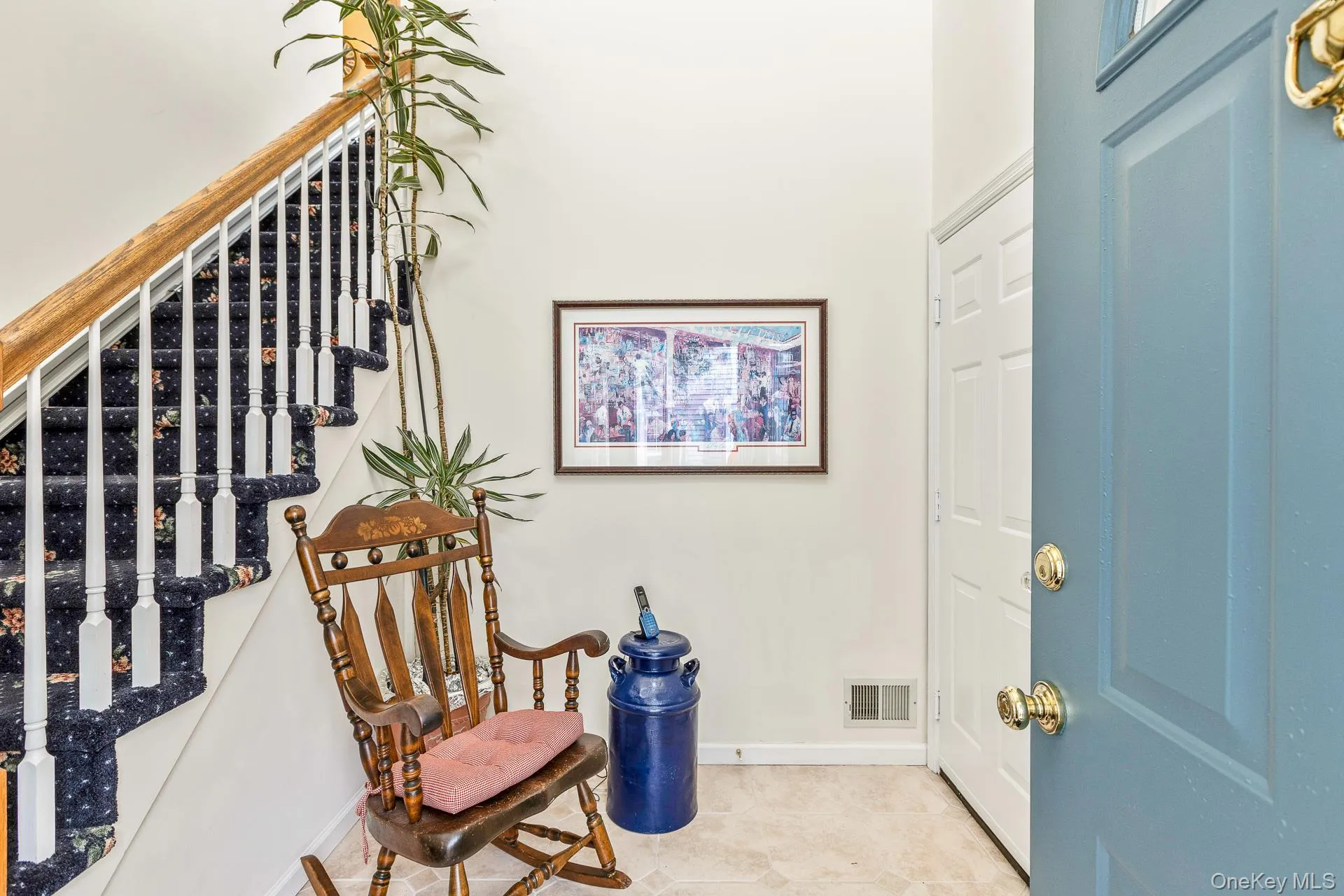 Foyer featuring stairway and baseboards Foyer featuring stairway and baseboards