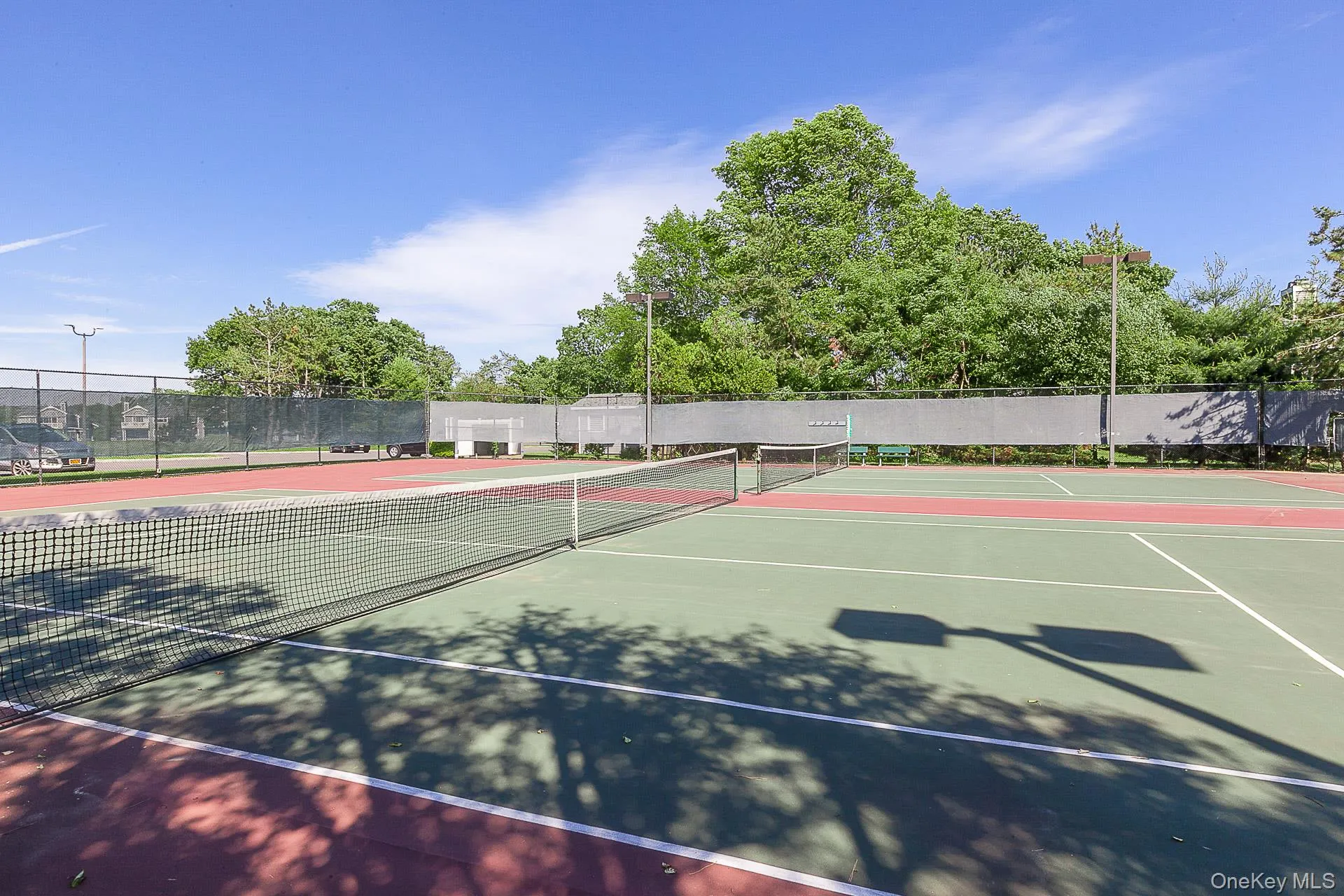 View of tennis court with community basketball court View of tennis court with community basketball court