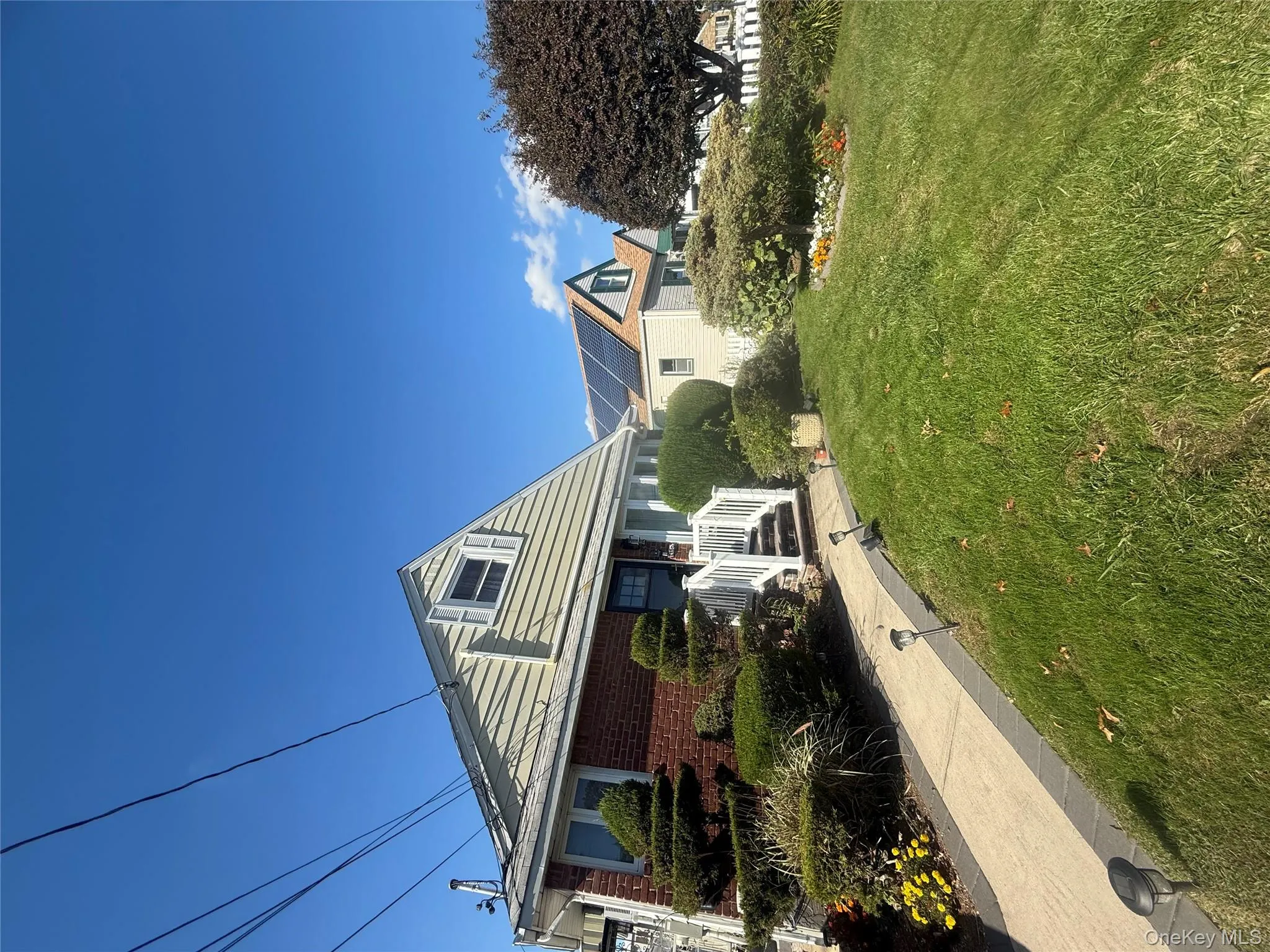 Bungalow-style house featuring a front lawn and brick siding Bungalow-style house featuring a front lawn and brick siding
