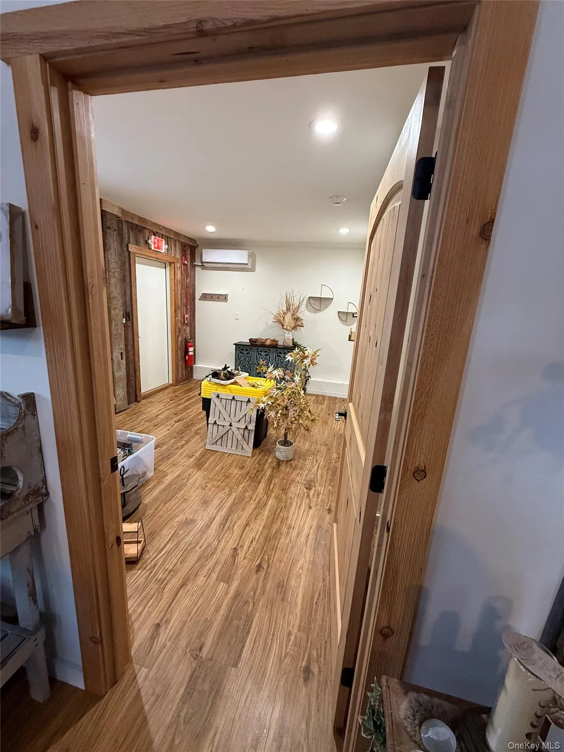 Corridor featuring wood finished floors Corridor featuring wood finished floors