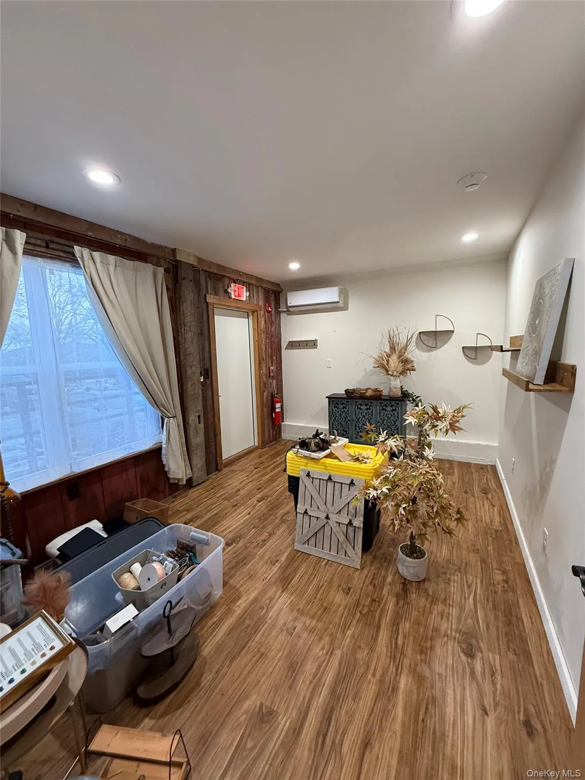 Living area with wood finished floors Living area with wood finished floors