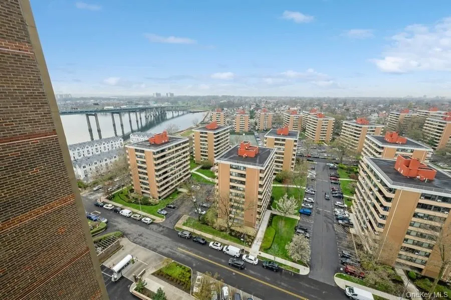 View of urban area with a notable bridge and a nearby body of water View of urban area with a notable bridge and a nearby body of water