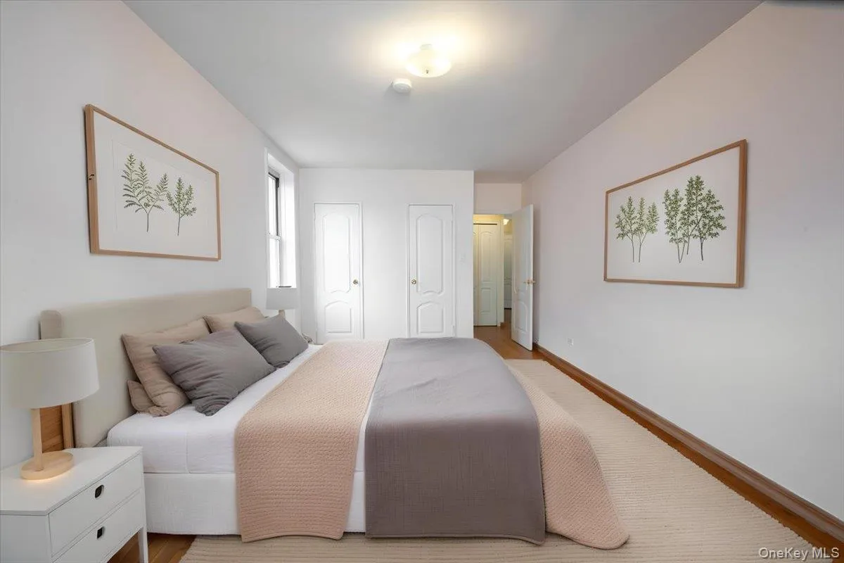 Staged Bedroom with two closets and baseboards Staged Bedroom with two closets and baseboards