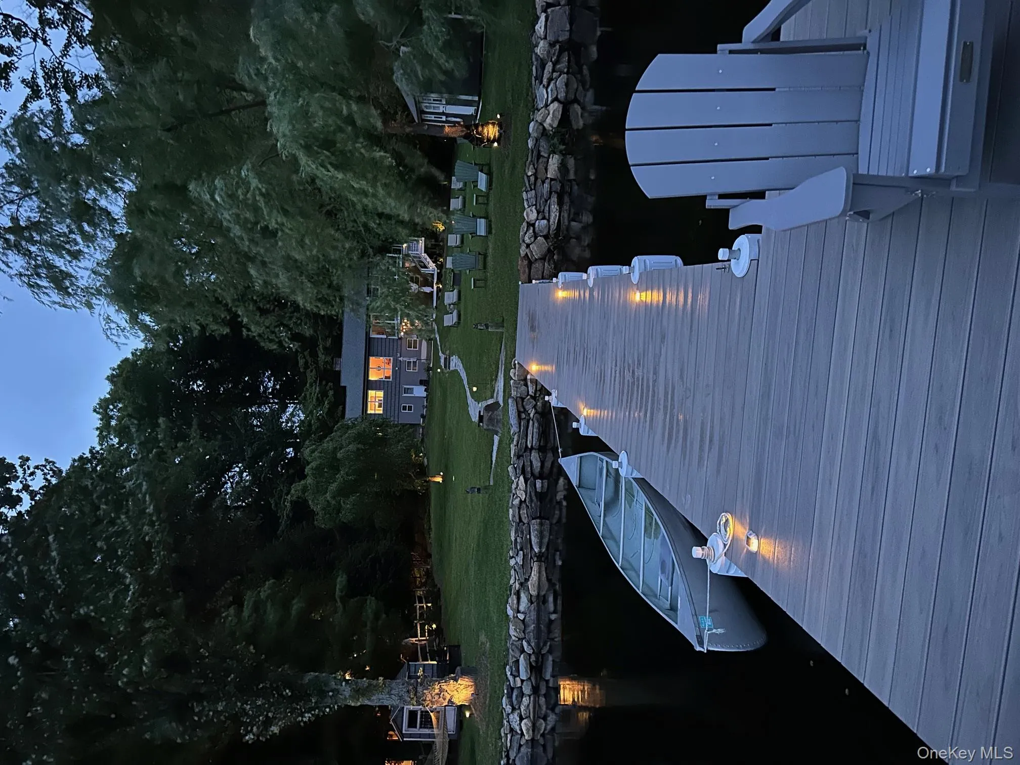 Dock featuring a yard and a water view Dock featuring a yard and a water view