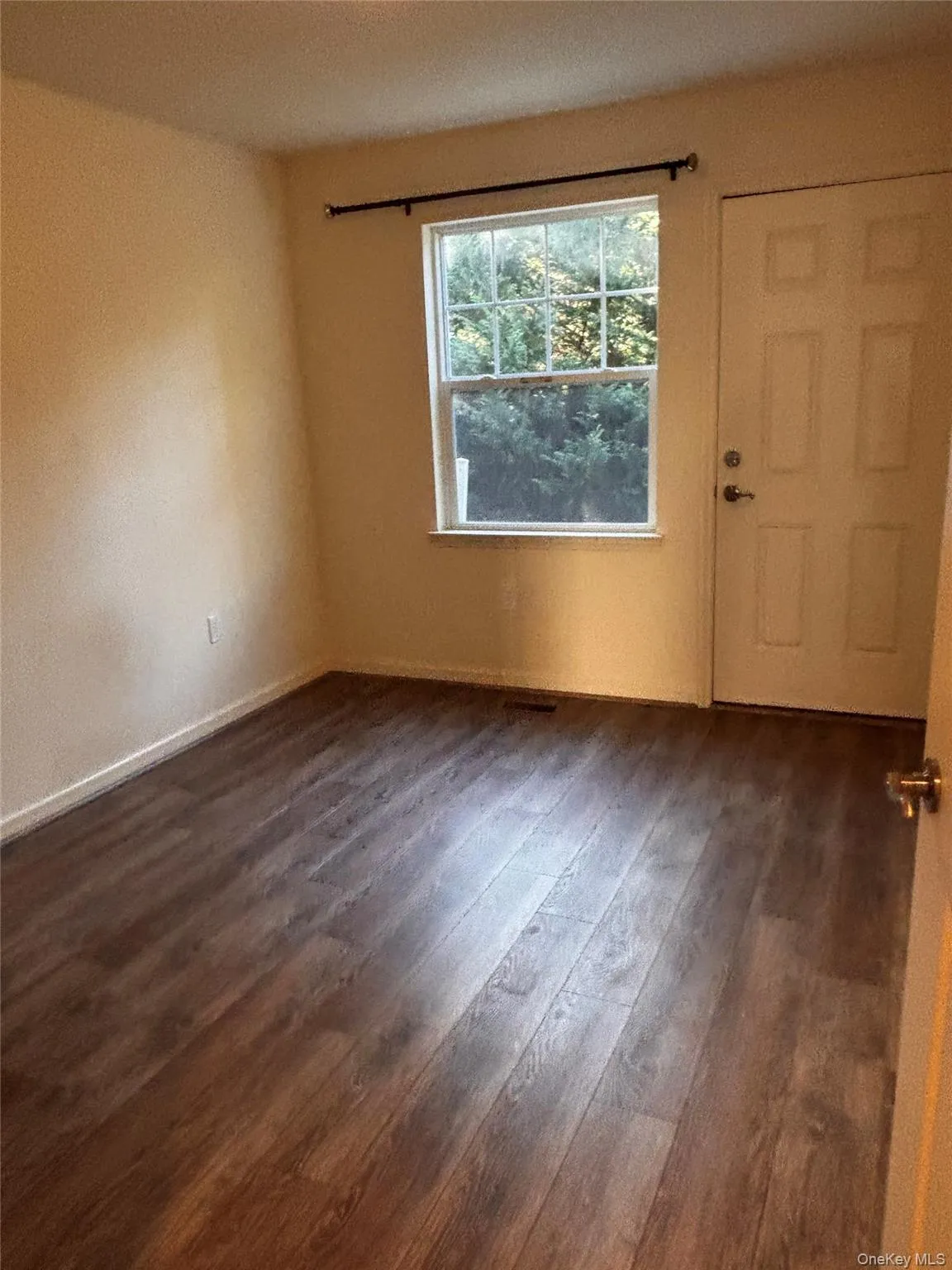 2nd bedroom with dark wood-type flooring and a textured ceiling 2nd bedroom with dark wood-type flooring and a textured ceiling