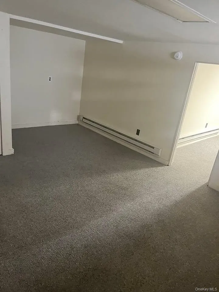 Empty room with baseboard heating Empty room with baseboard heating