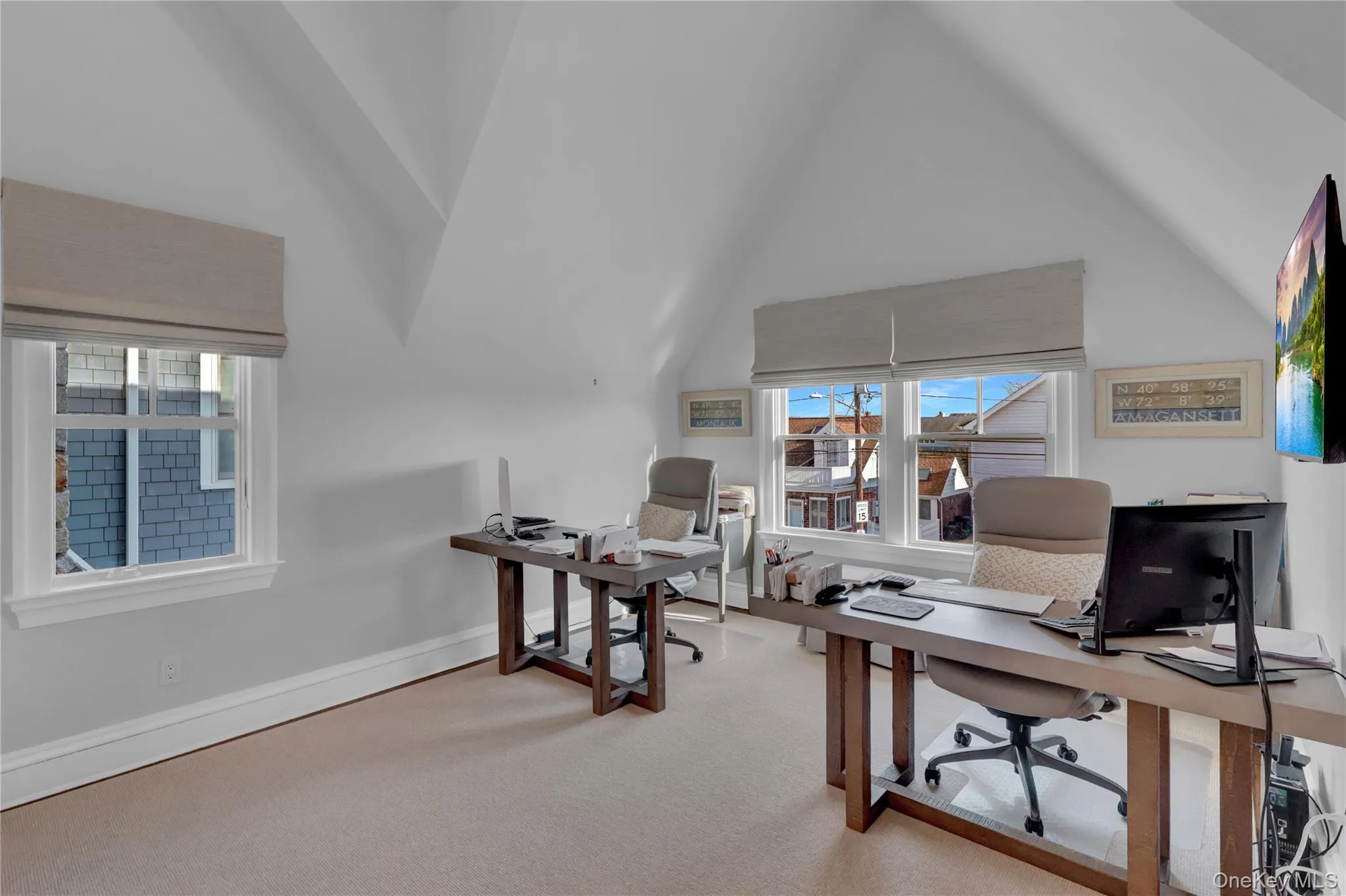 Office featuring light colored carpet and high vaulted ceiling Office featuring light colored carpet and high vaulted ceiling