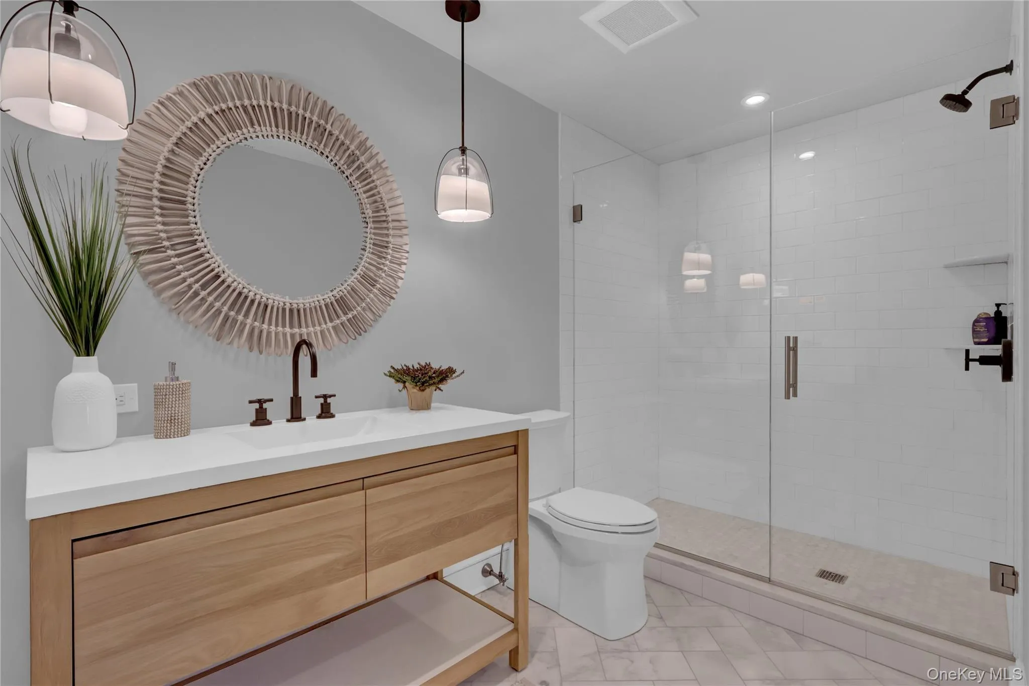 Bathroom with vanity, a shower stall, and recessed lighting Bathroom with vanity, a shower stall, and recessed lighting