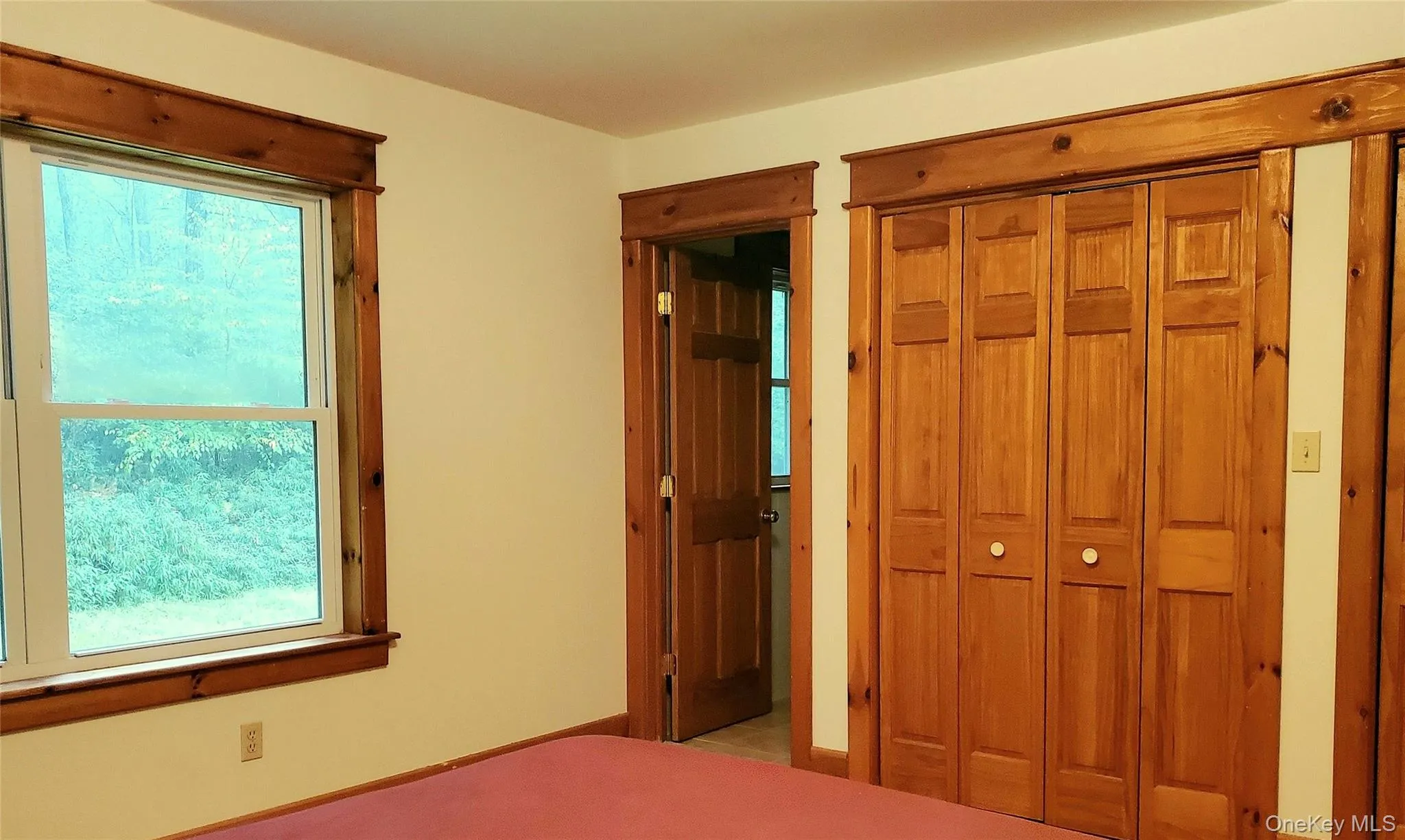 Hardwood floors, large window, wood trim and doors Hardwood floors, large window, wood trim and doors