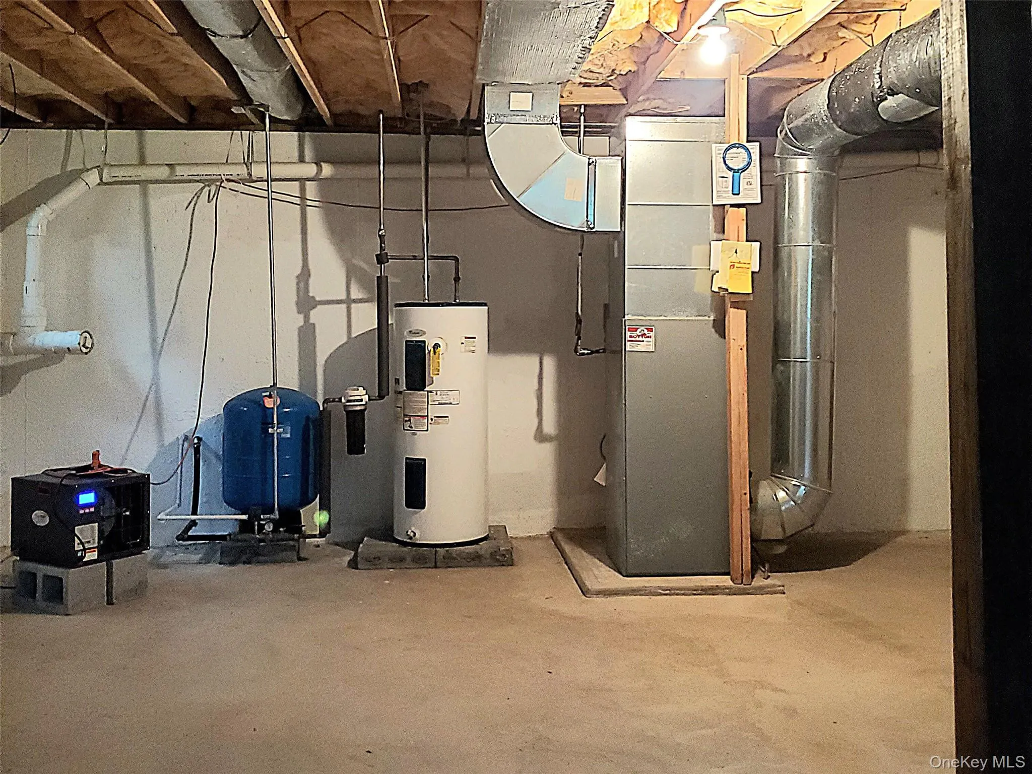 Utility room with water heater Utility room with water heater