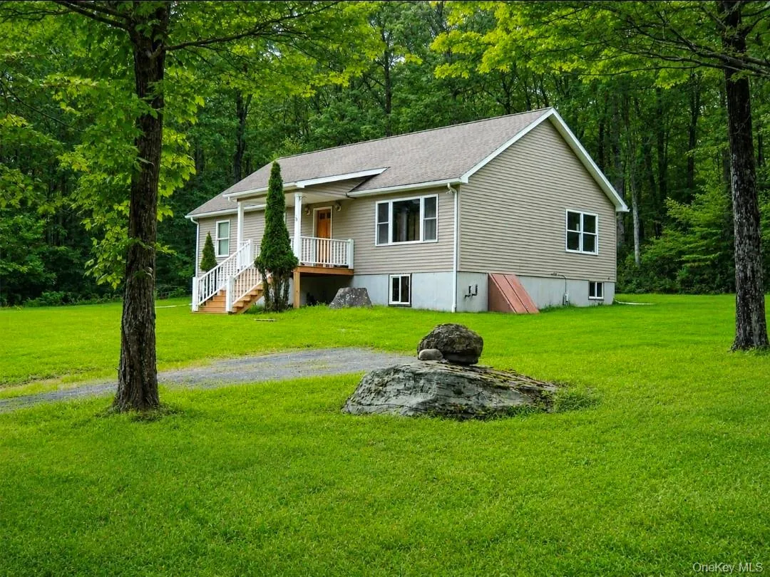 View of front of house with a front lawn and covered porch View of front of house with a front lawn and covered porch
