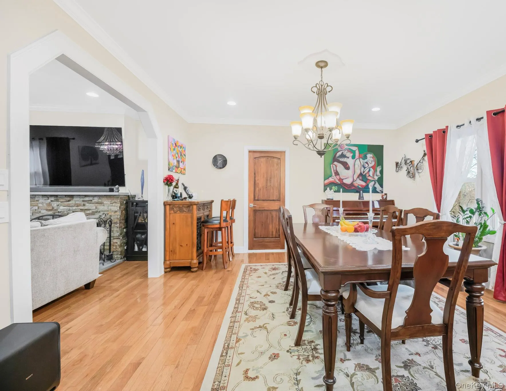 Dining room featuring light wood-style flooring, crown molding, a chandelier, and recessed lighting Dining room featuring light wood-style flooring, crown molding, a chandelier, and recessed lighting