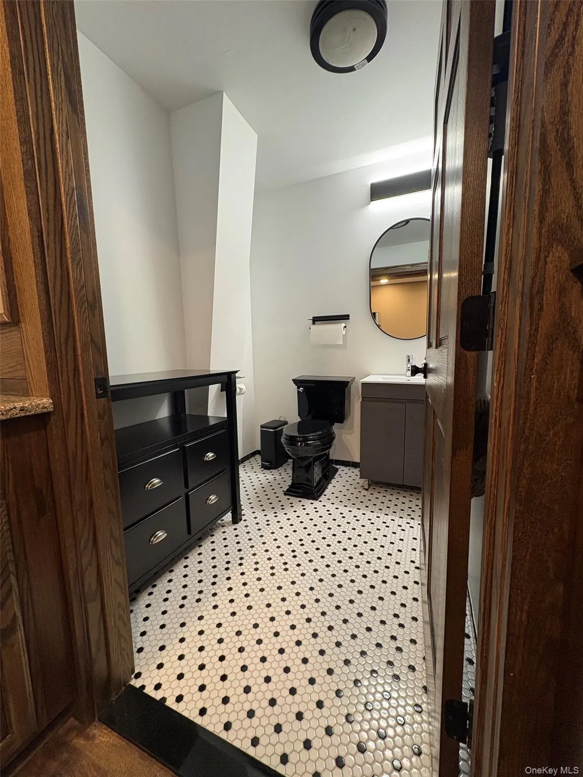 Half bath with vanity and toilet Half bath with vanity and toilet