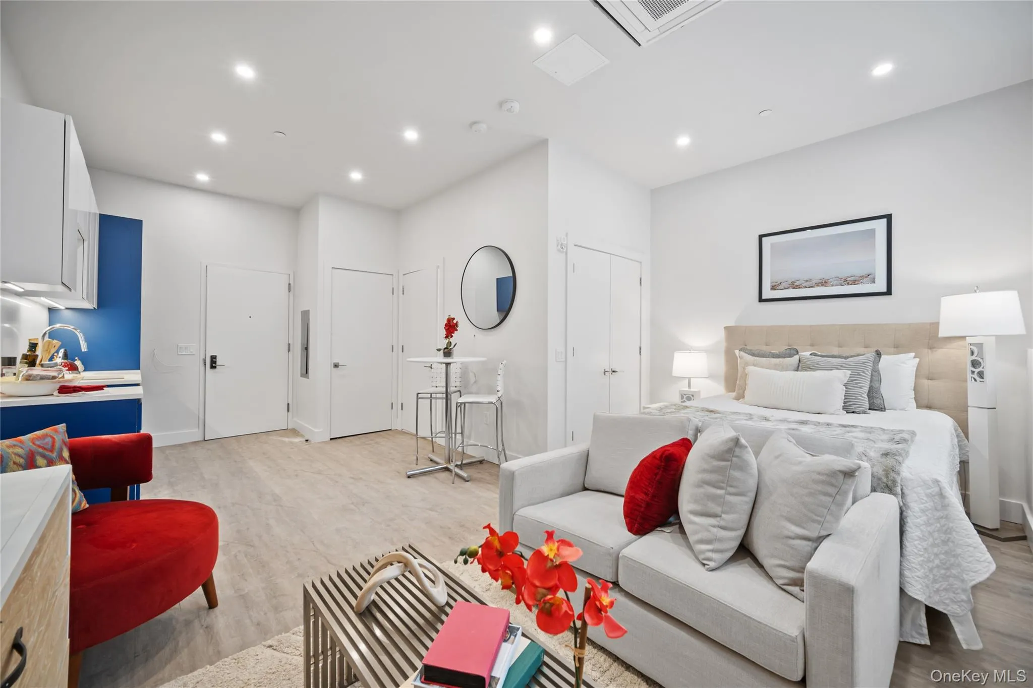 Bedroom featuring cooling unit, recessed lighting, and light wood-style floors Bedroom featuring cooling unit, recessed lighting, and light wood-style floors