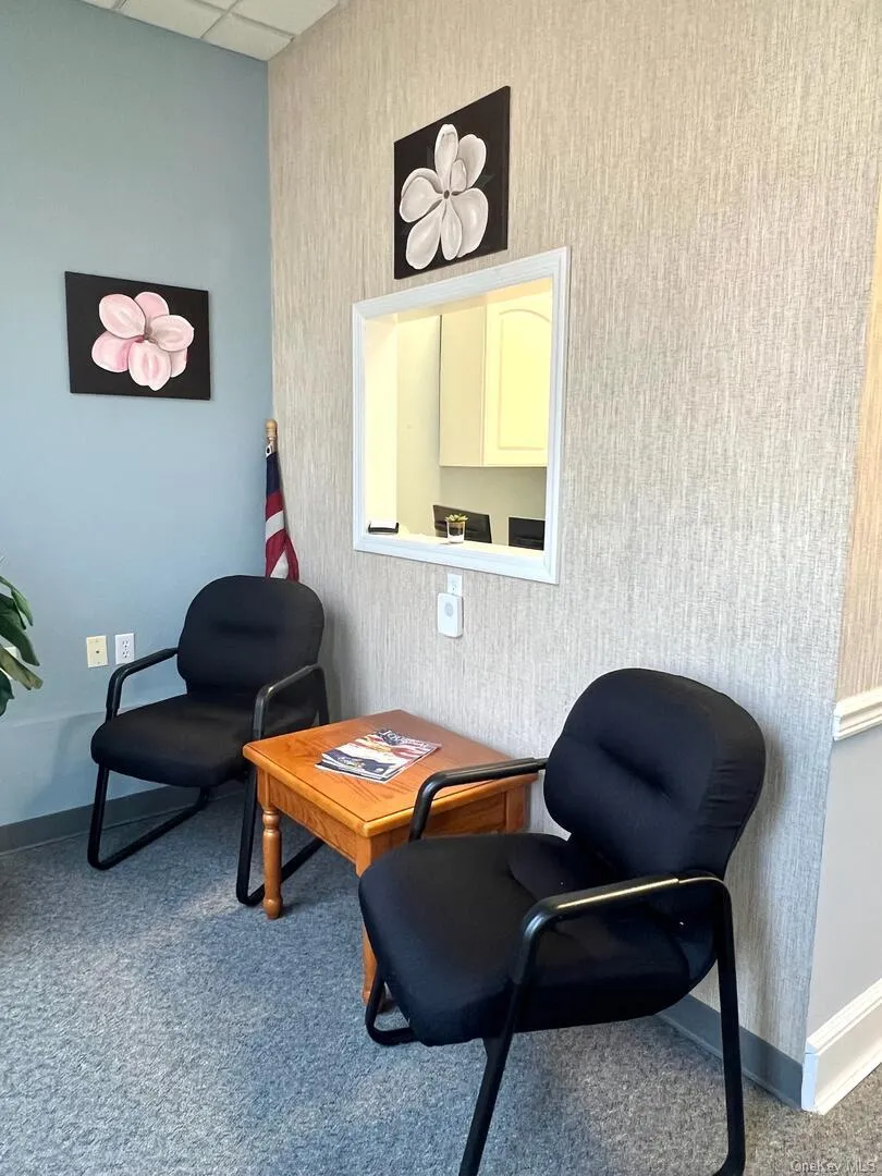 Living area featuring a paneled ceiling Living area featuring a paneled ceiling
