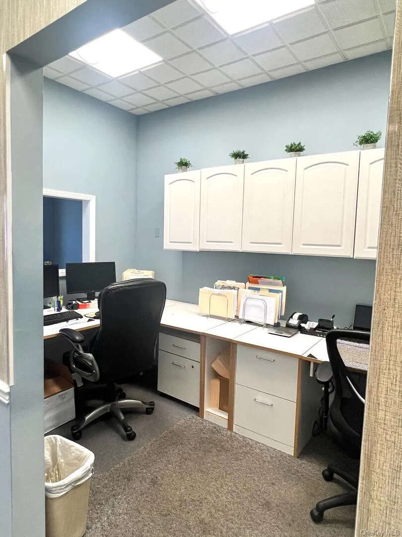 Office featuring a paneled ceiling and built in study area Office featuring a paneled ceiling and built in study area