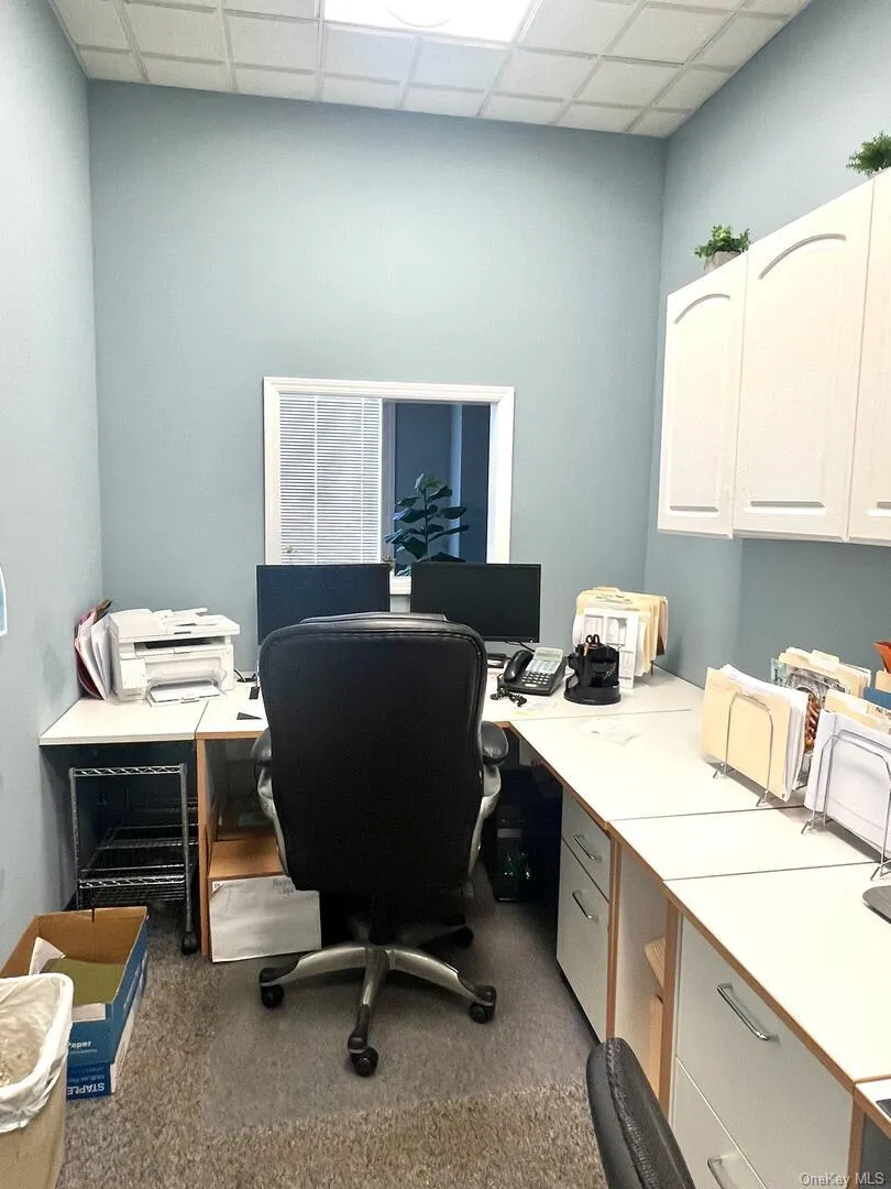 Office area with a drop ceiling Office area with a drop ceiling