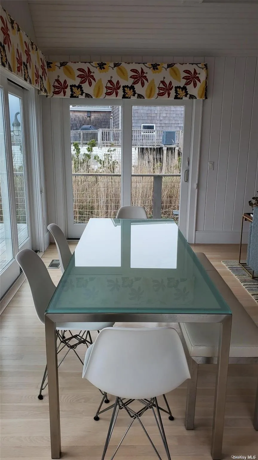 Dining room with light wood finished floors Dining room with light wood finished floors