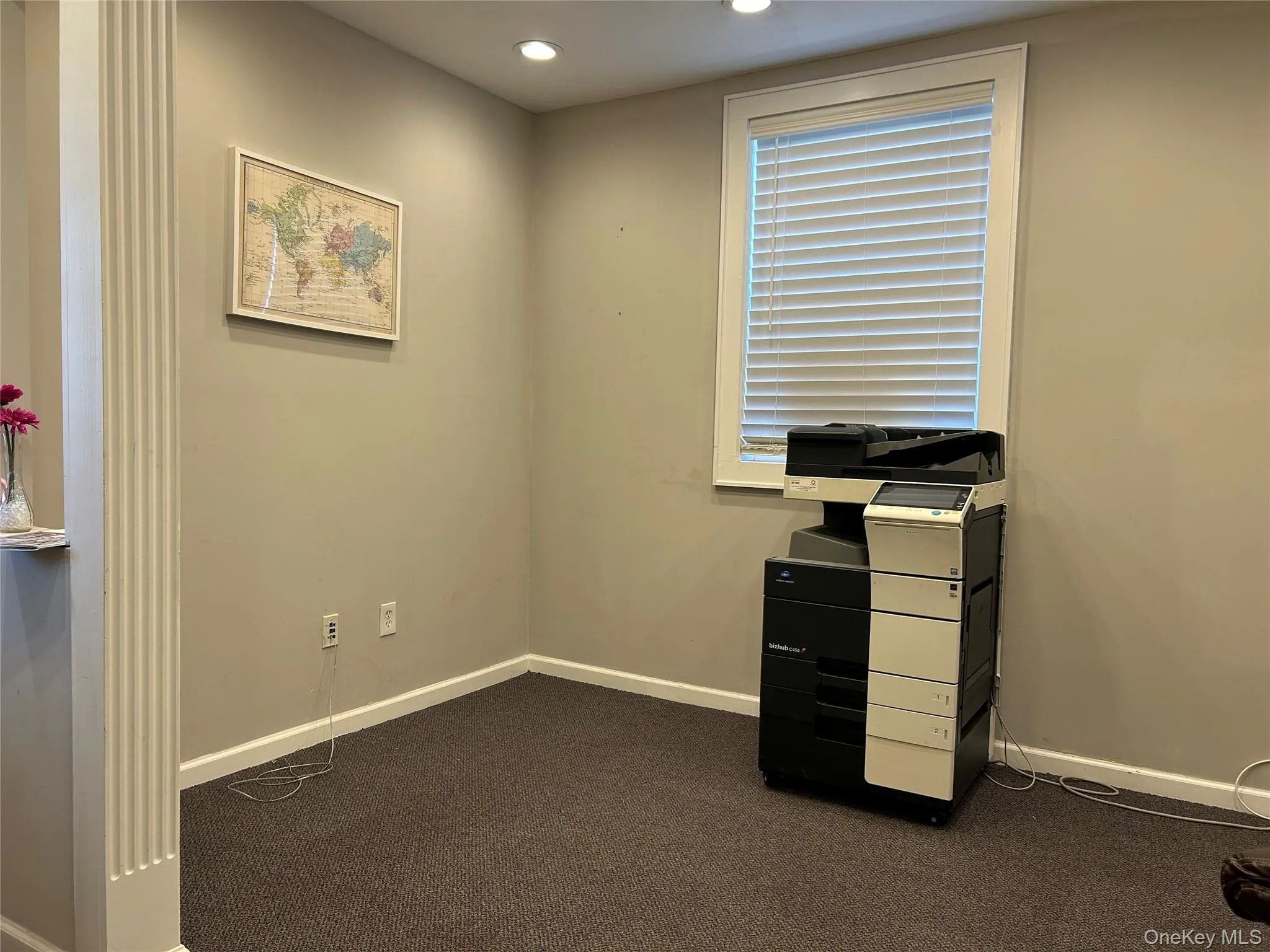 Unfurnished office with recessed lighting and dark carpet Unfurnished office with recessed lighting and dark carpet