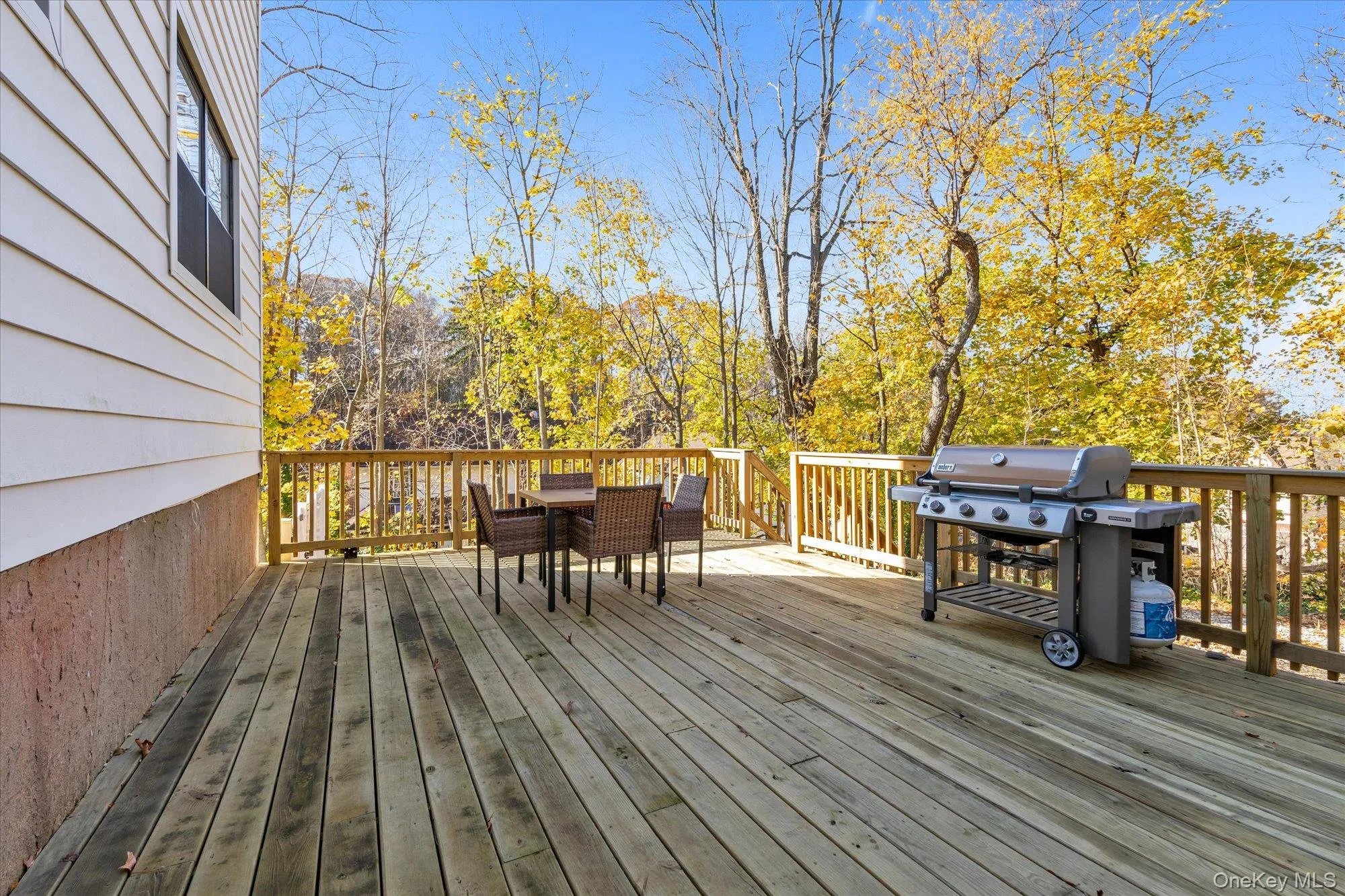 Deck featuring outdoor dining area and area for grilling Deck featuring outdoor dining area and area for grilling