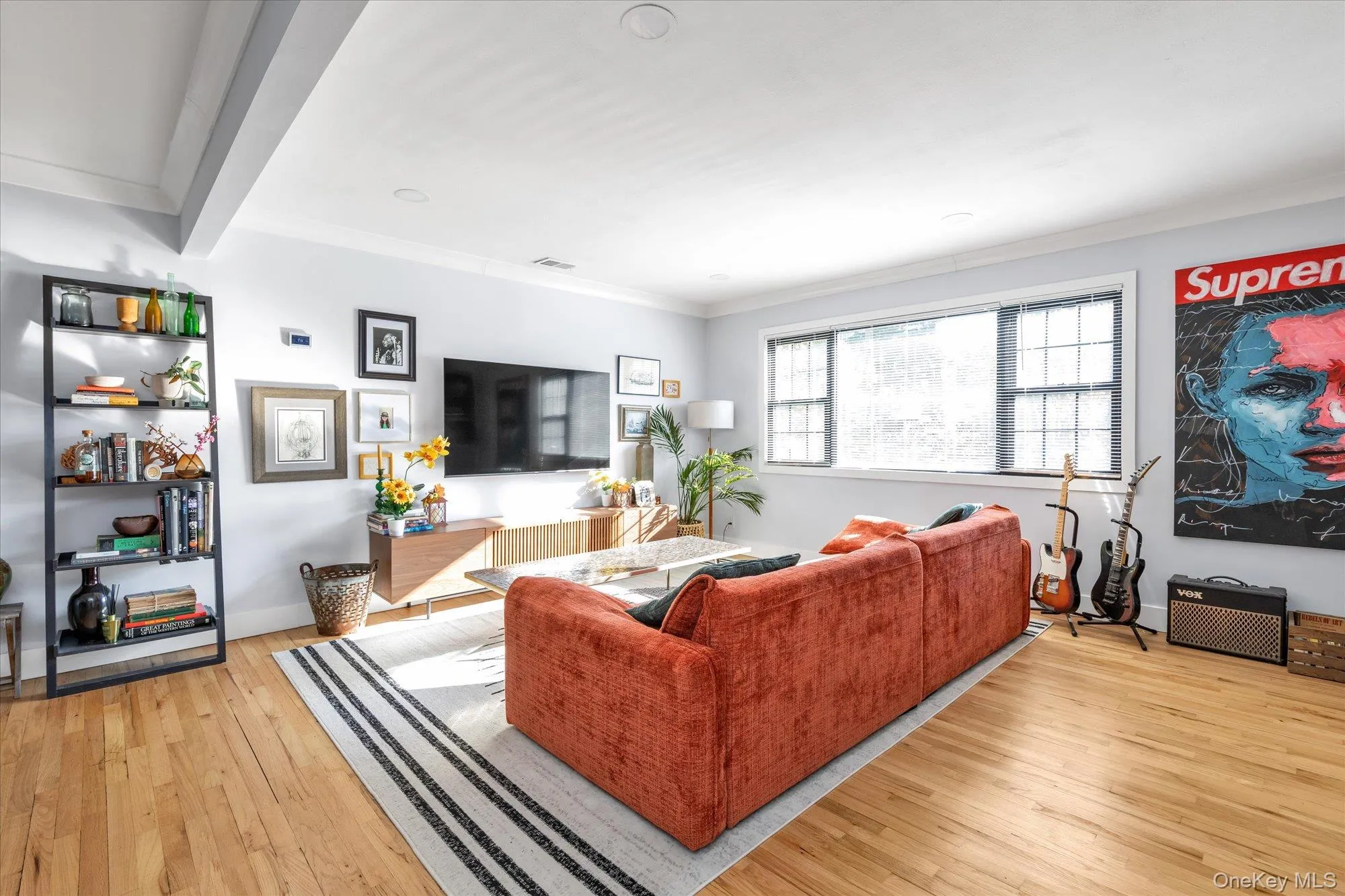Living room with crown molding and hard wood flooring Living room with crown molding and hard wood flooring