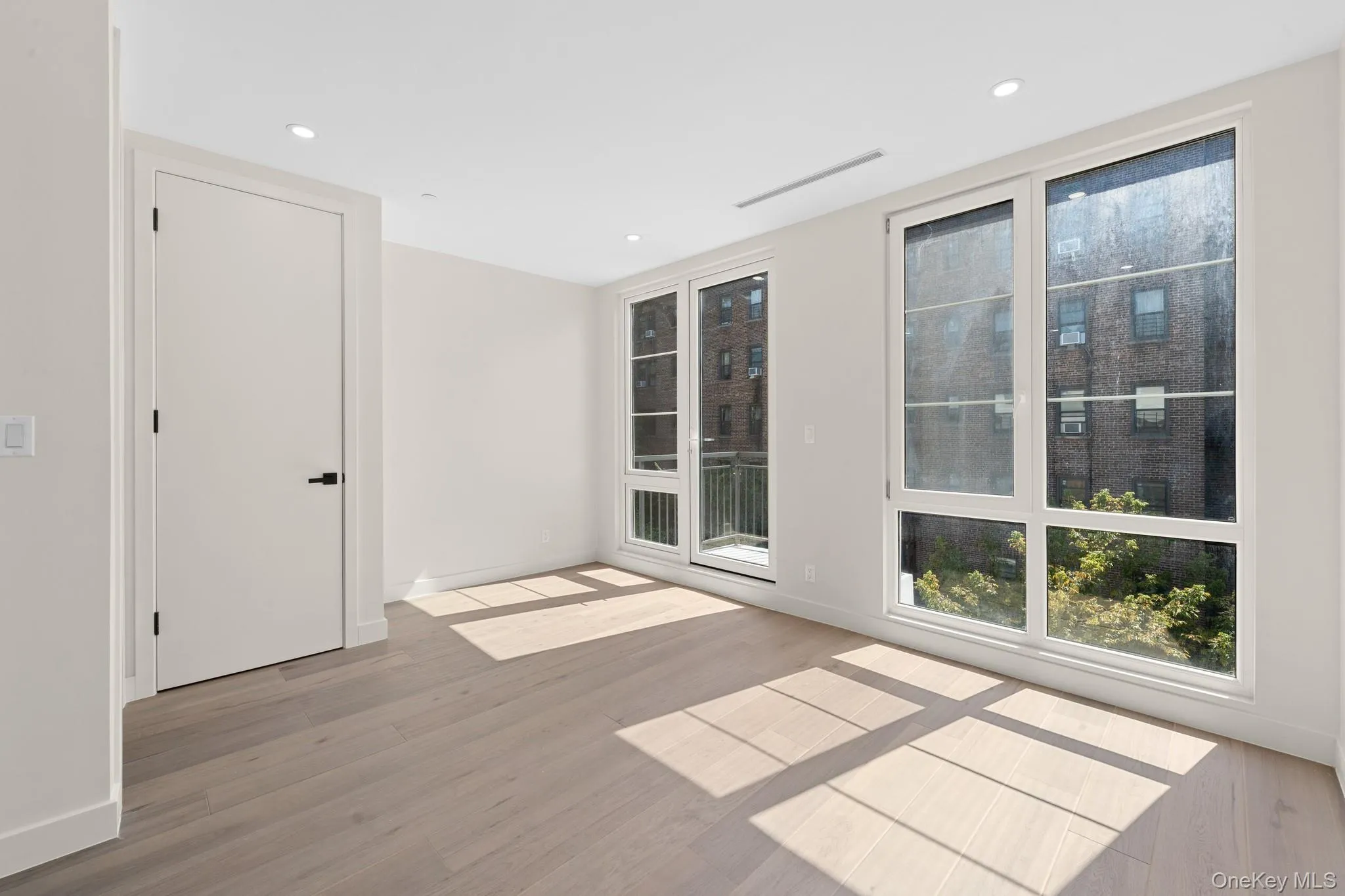 Unfurnished room with light wood-style flooring and recessed lighting Unfurnished room with light wood-style flooring and recessed lighting